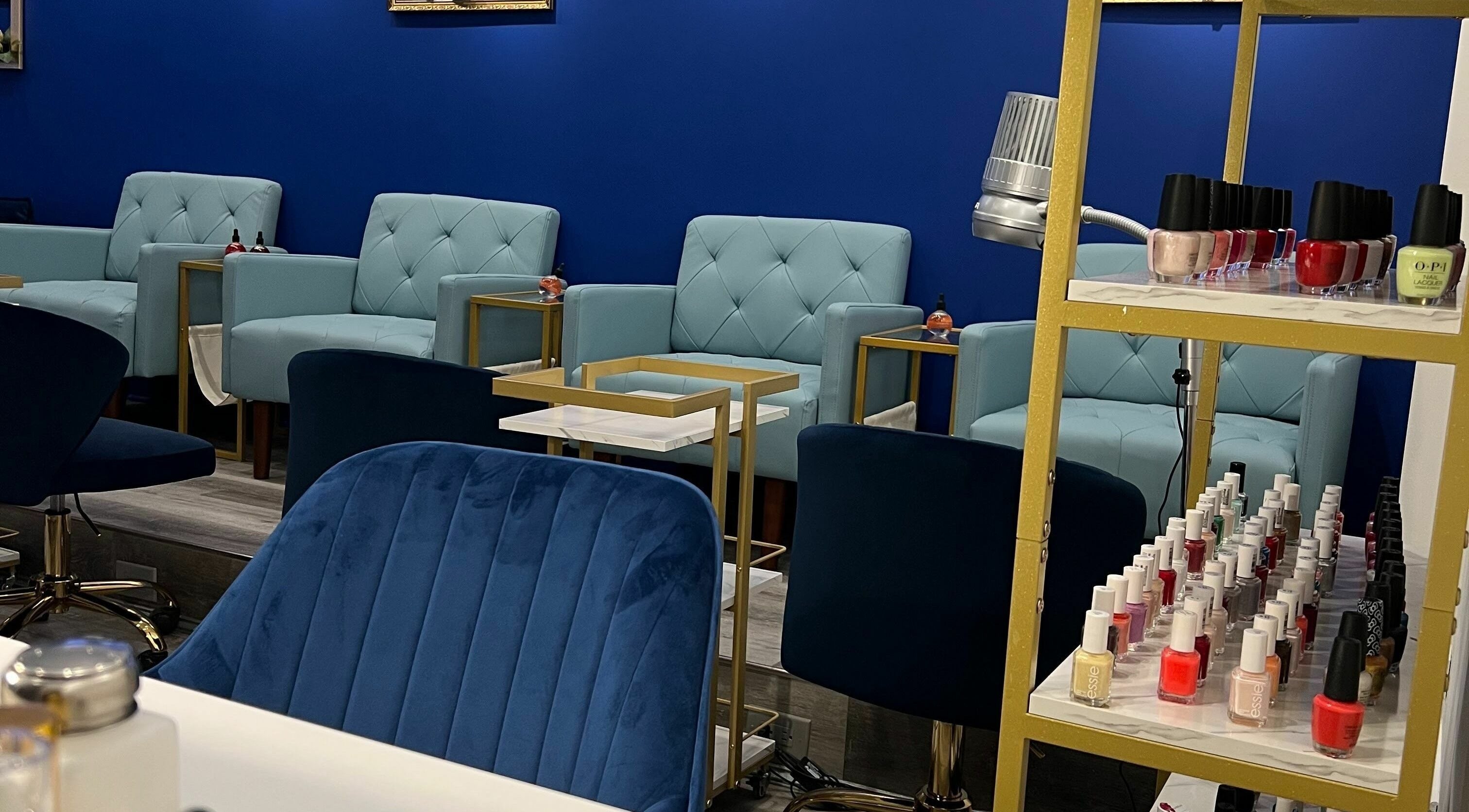 Inviting lounge at Mon Cheri Chitown in Chicago, Illinois, US with plush seating and nail polish display.