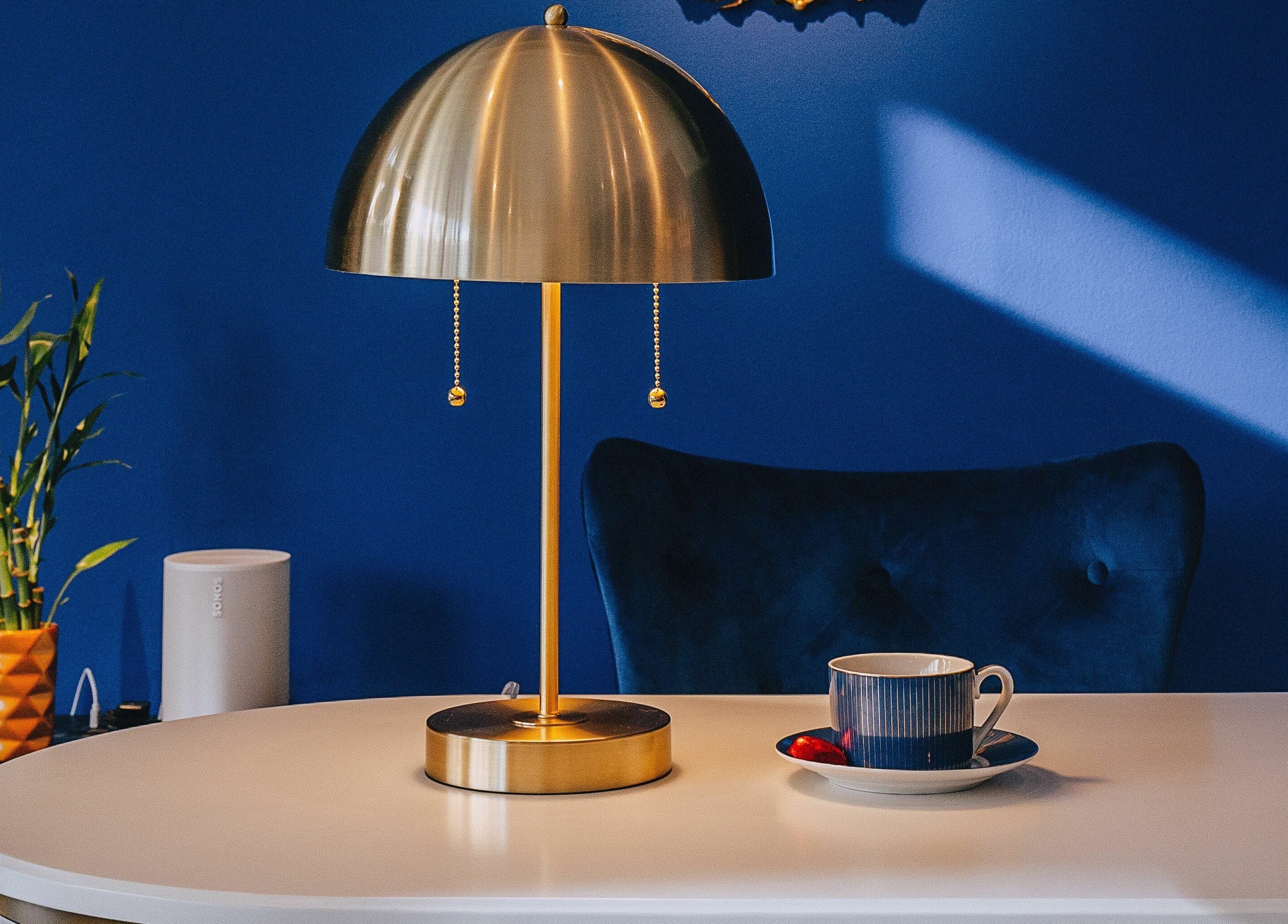 Chic table setting with lamp and decor at Mon Cheri Chitown, Chicago, Illinois, US.