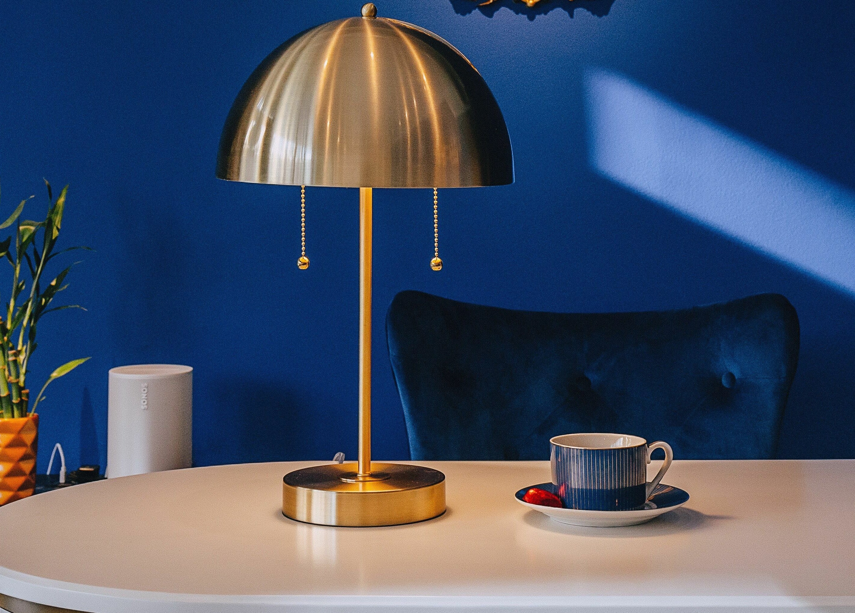 Chic table setting with lamp and decor at Mon Cheri Chitown, Chicago, Illinois, US.