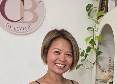 Friendly stylist at Complete Beauty by Cathy, Neutral Bay, New South Wales, AU, welcomes clients in a chic setting.