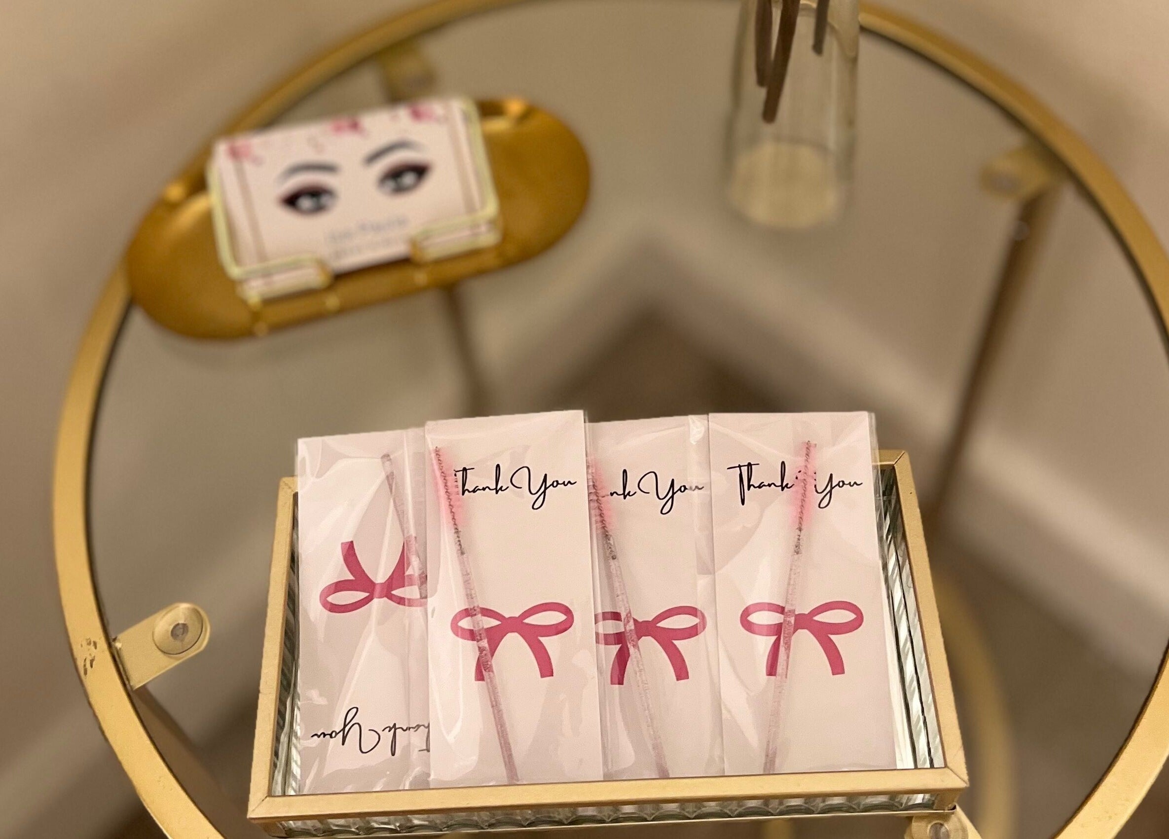 Isa Paula lashes and Beauty gift bags on a round glass table in London, England, GB.