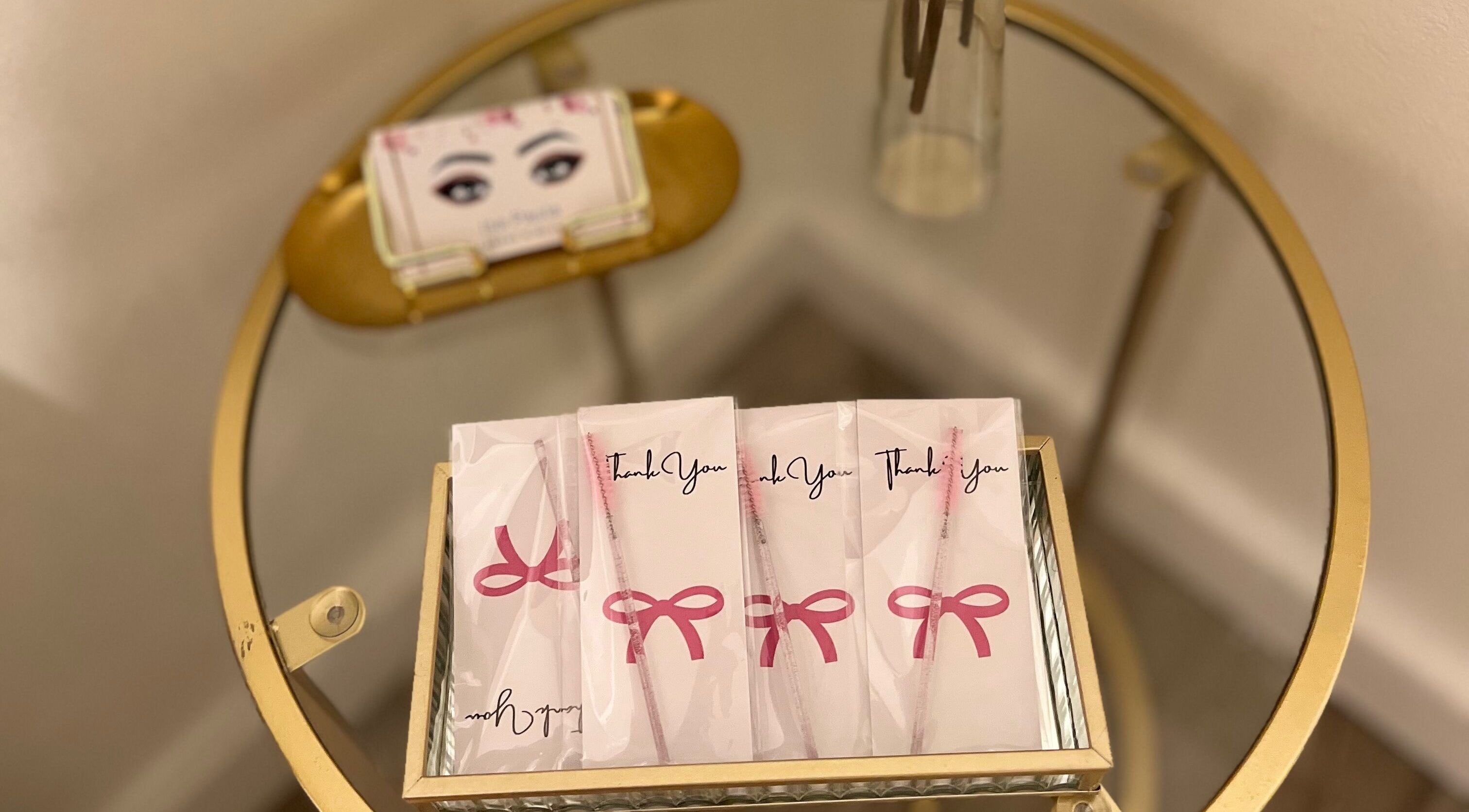 Isa Paula lashes and Beauty gift bags on a round glass table in London, England, GB.