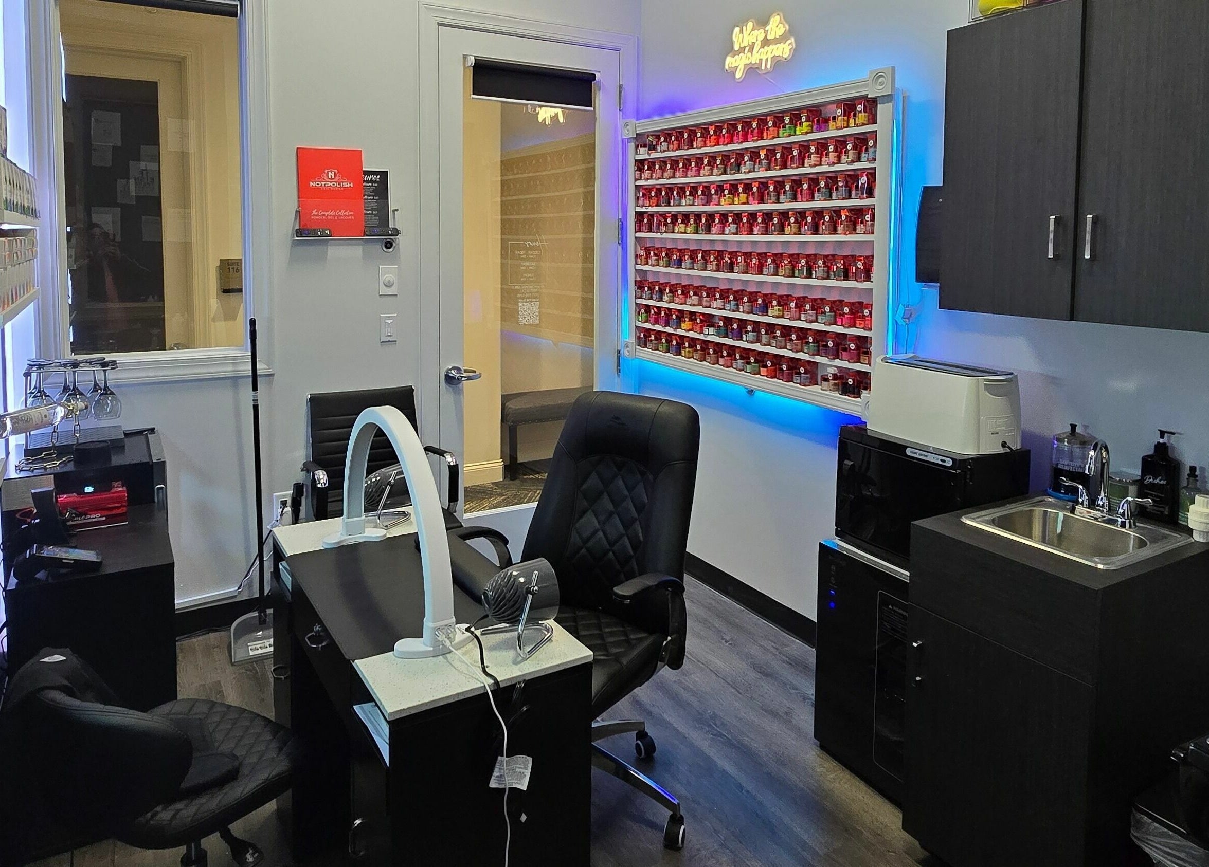 Modern nail salon interior at Mr. Right Nails at Phenix Salon Suites, Columbus, Ohio, US, showcasing vibrant polish wall.