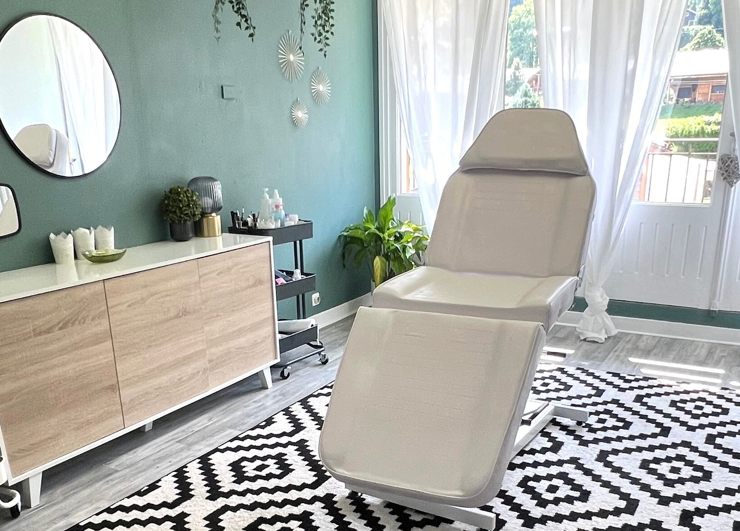 Relaxing treatment room at The Eye-Brow Bar by Laura, Essert-romand, Auvergne-rhône-alpes, FR, with stylish decor.