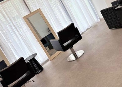 Modern salon interior at Saskii Hair, Surfers Paradise, Queensland, AU, showing chairs and mirrors.