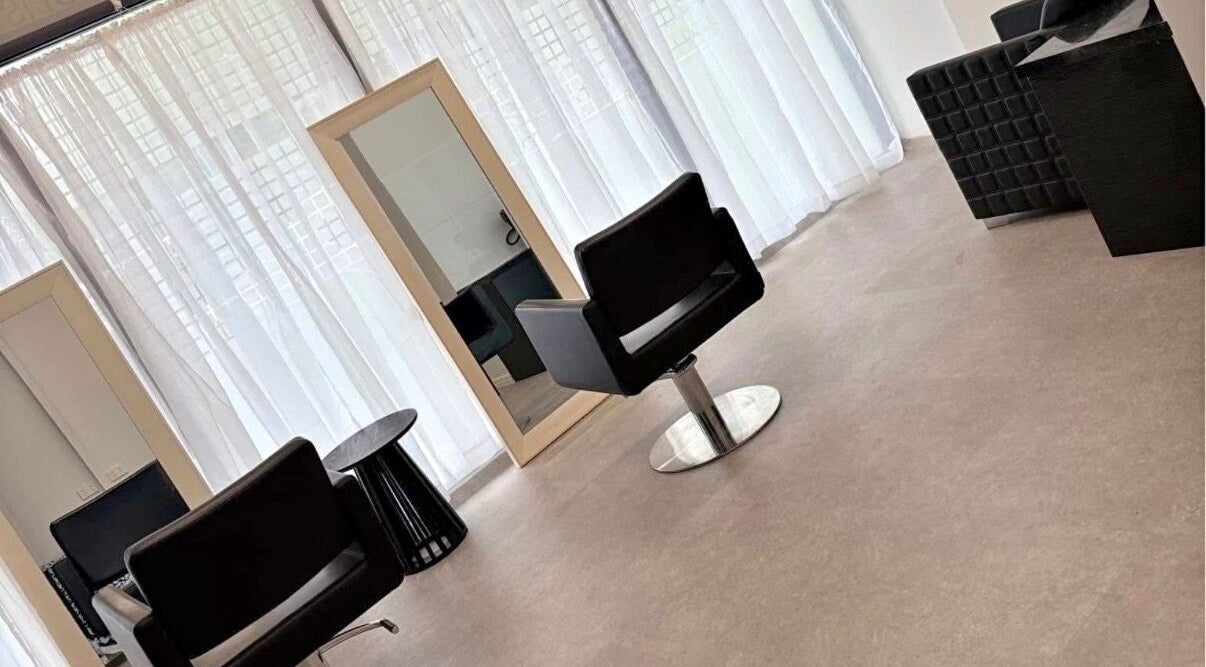 Modern salon interior at Saskii Hair, Surfers Paradise, Queensland, AU, showing chairs and mirrors.