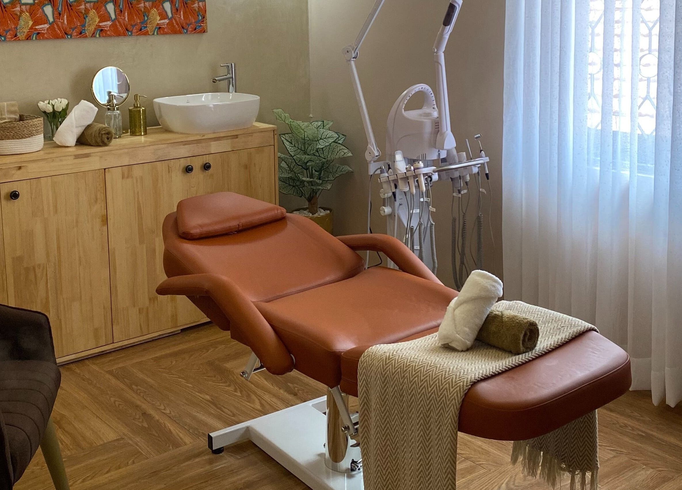 Relaxing treatment room at The Pod, Kampala, Central Region, UG with massage chair and soothing decor.