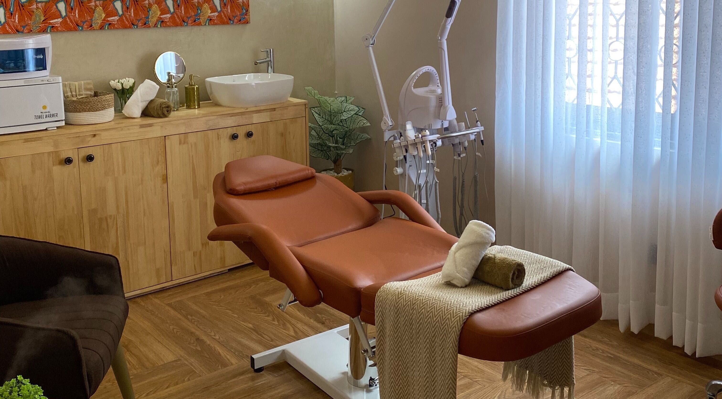 Relaxing treatment room at The Pod, Kampala, Central Region, UG with massage chair and soothing decor.