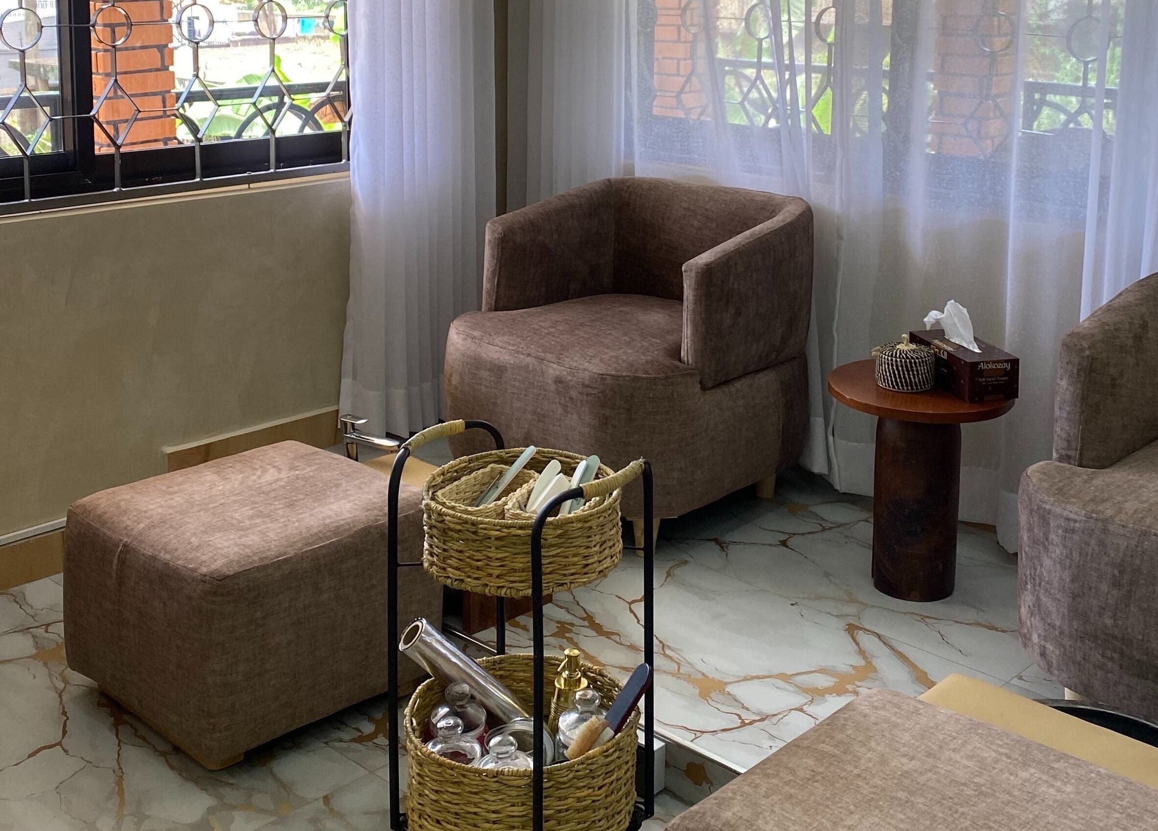 Relax in cozy seating at The Pod, Kampala, Central Region, UG, with elegant decor and natural lighting.