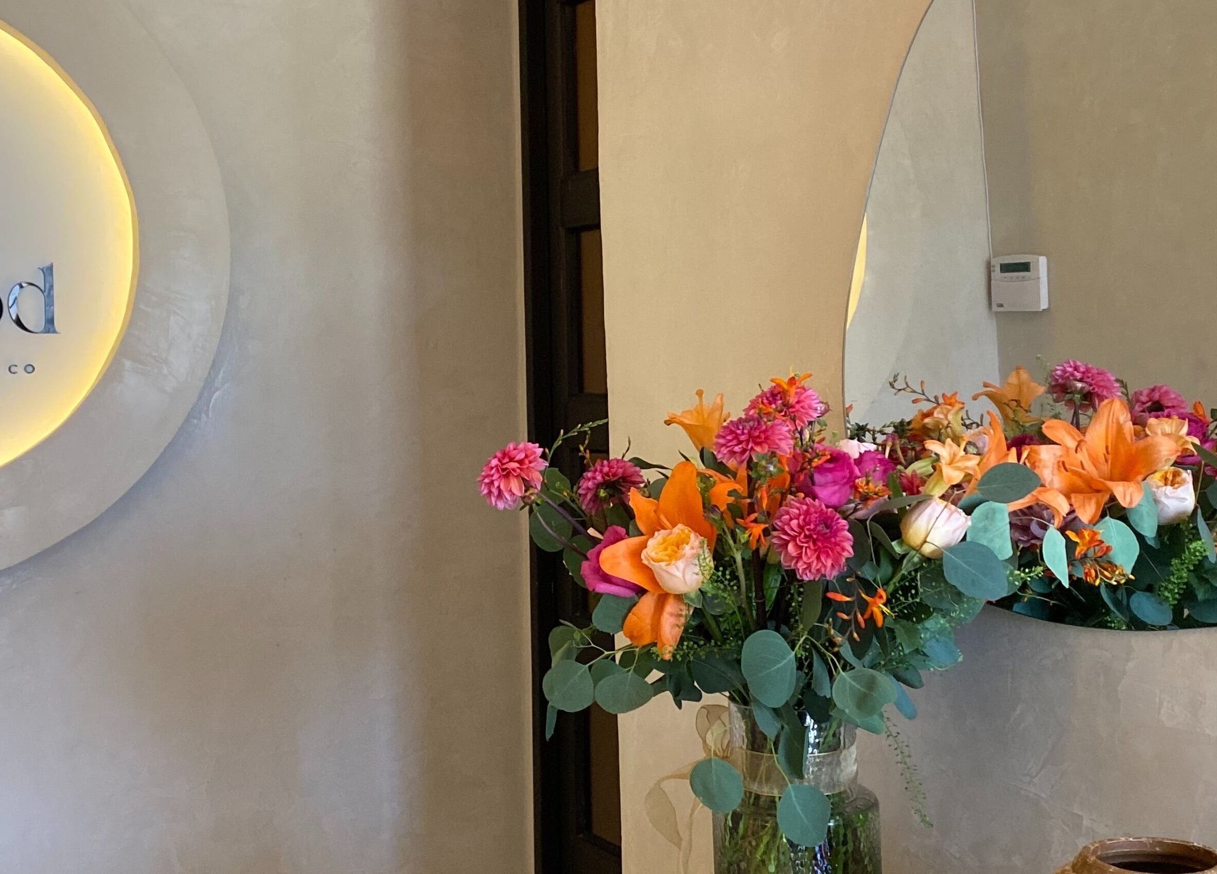 A vibrant floral arrangement at The Pod, Kampala, Central Region, UG, adding warmth to the beauty venue.