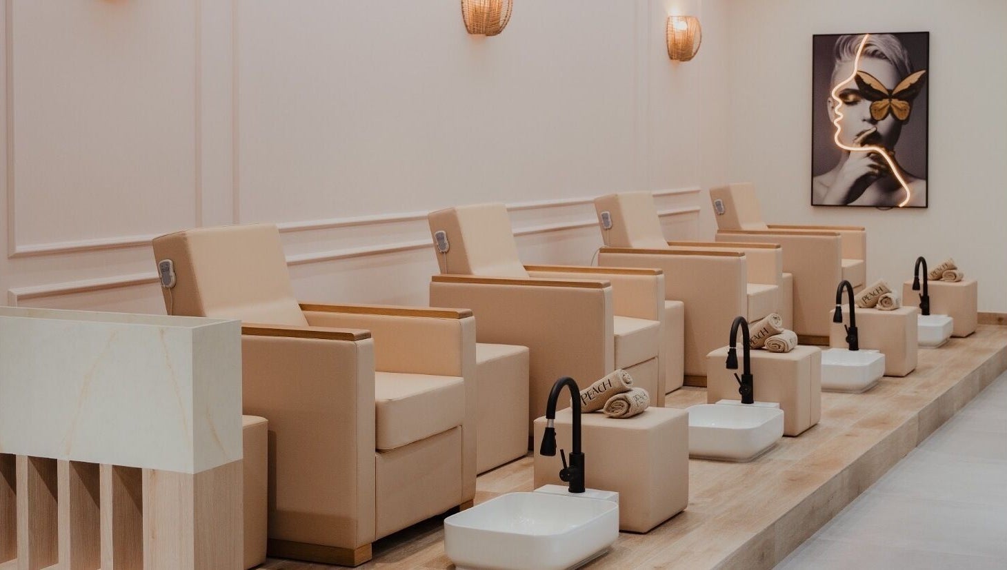 Elegant seating for pedicures at Peach Beauty Bar, Dubai, Dubai, AE, showcasing luxury spa experience.
