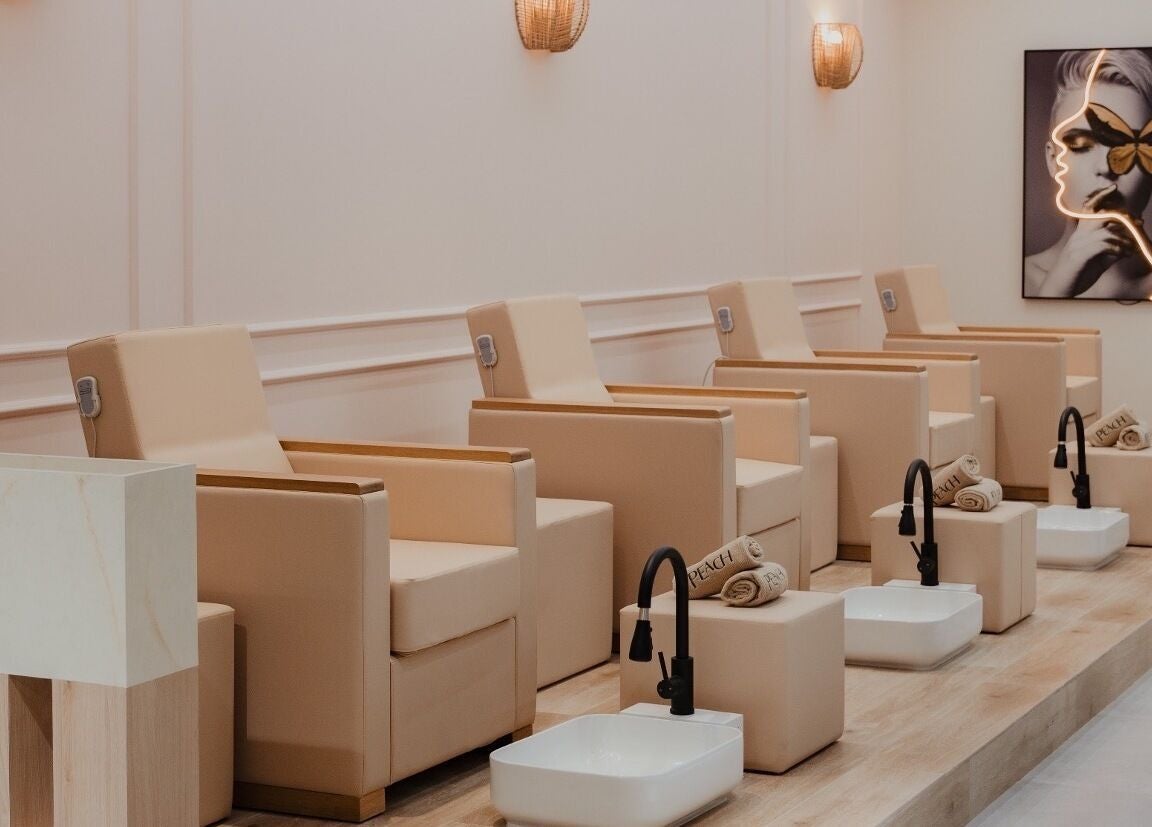 Elegant seating for pedicures at Peach Beauty Bar, Dubai, Dubai, AE, showcasing luxury spa experience.