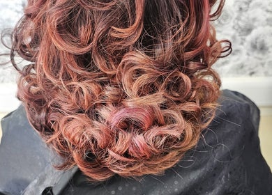 Curly hairstyle at Daniel hair and beauty, Slough, England, GB, showcasing texture and volume.