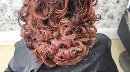 Curly hairstyle at Daniel hair and beauty, Slough, England, GB, showcasing texture and volume.