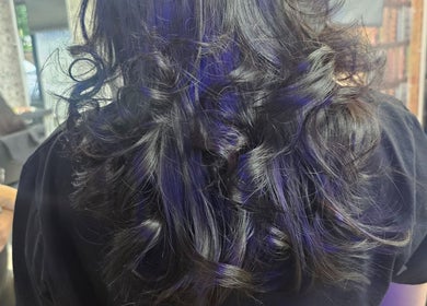 Voluminous curls styled beautifully at Daniel hair and beauty, Slough, England, GB.