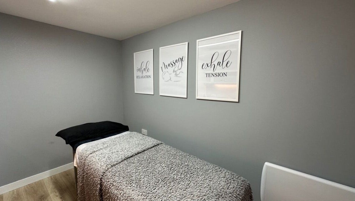 Massage room at ELM Therapy, Buckingham, England, GB with calm decor and relaxation quotes.