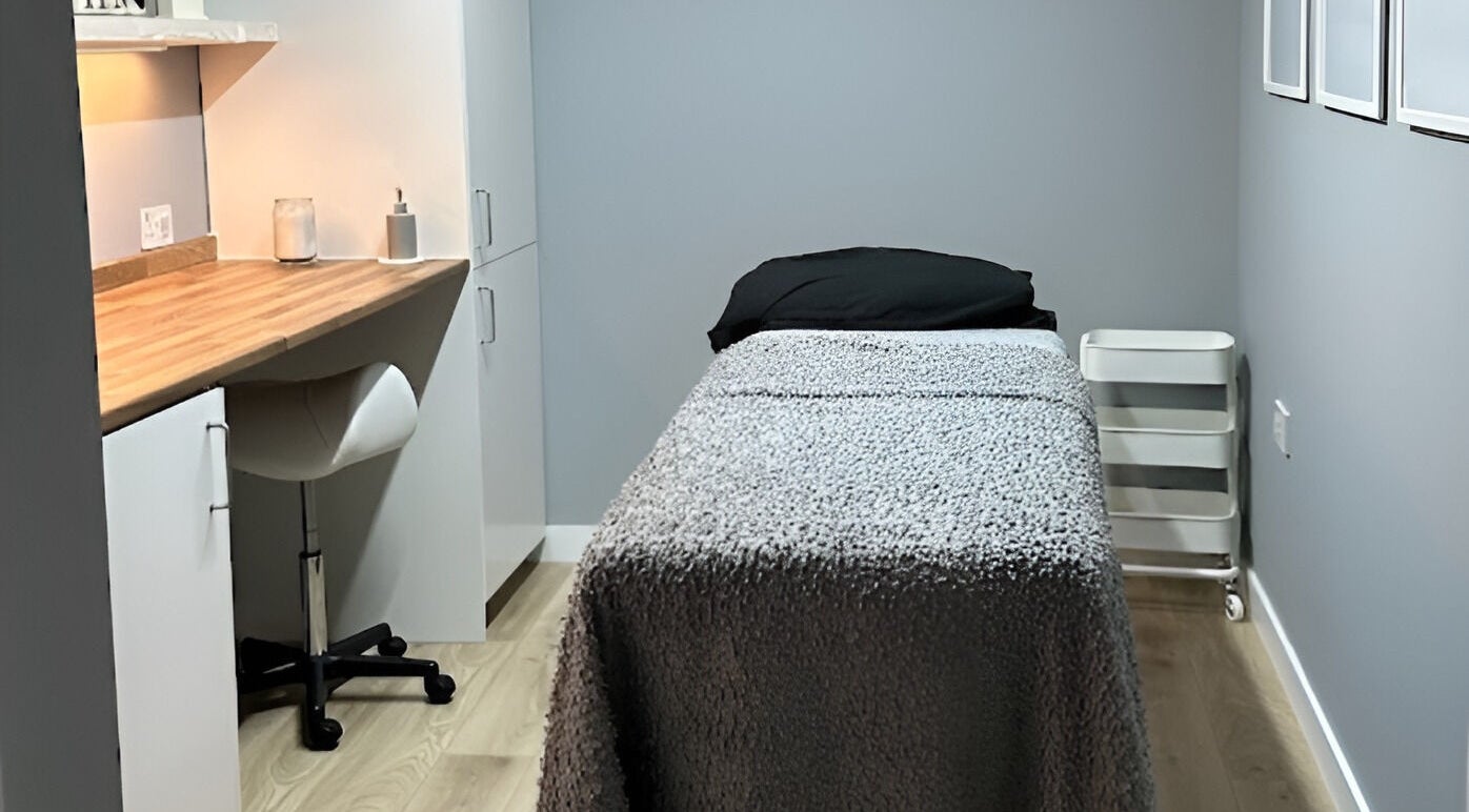 Cozy therapy room at ELM Therapy, Buckingham, England, GB, featuring a comfortable treatment bed and calming decor.