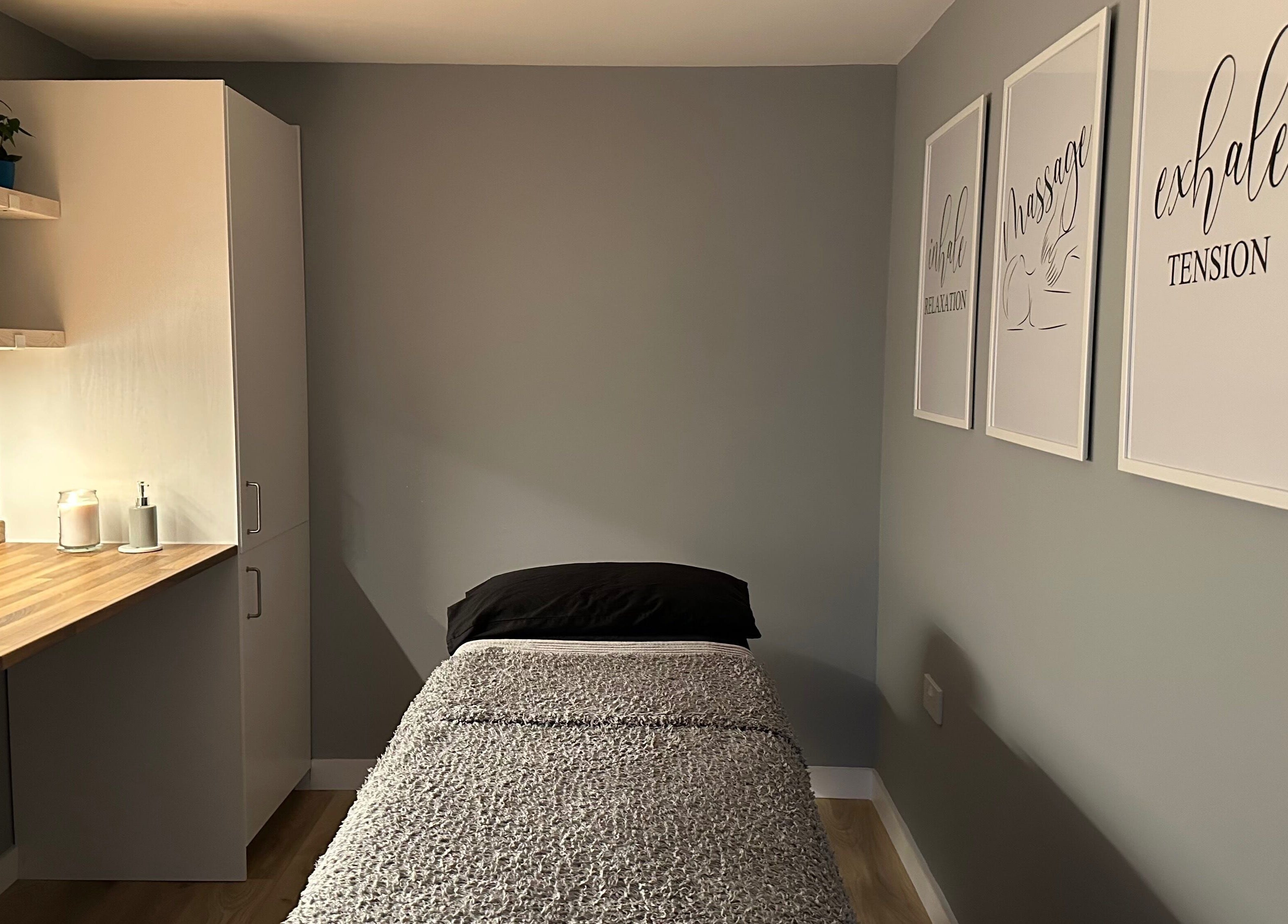 Cozy massage room at ELM Therapy, Buckingham, England, GB, featuring calming decor and a comfortable bed.