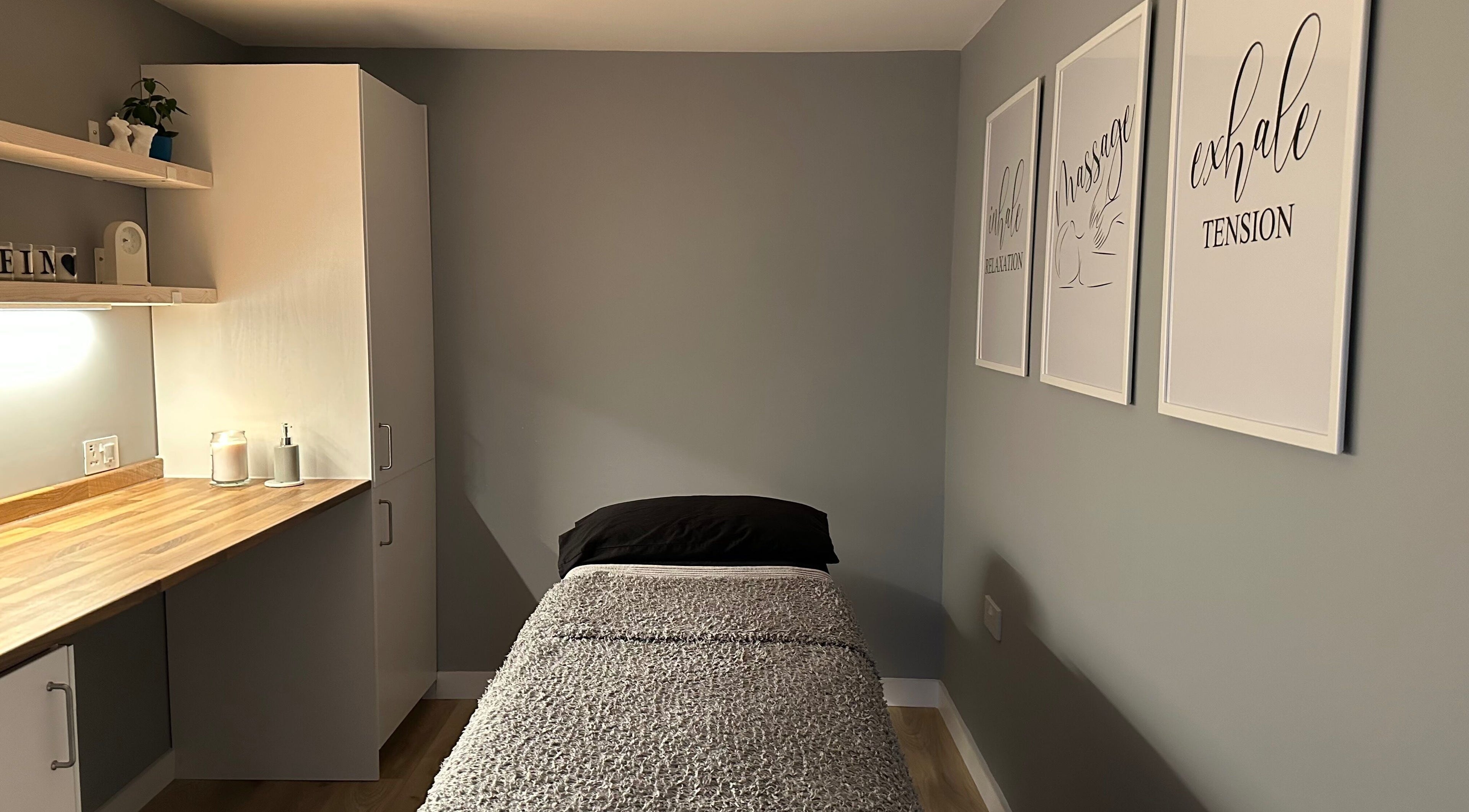 Cozy massage room at ELM Therapy, Buckingham, England, GB, featuring calming decor and a comfortable bed.