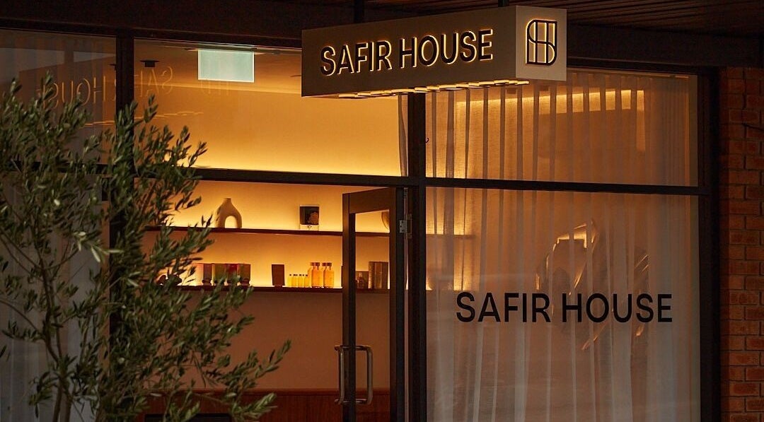Cozy entrance of Safir House in Merimbula, New South Wales, AU, with elegant lighting and decor.