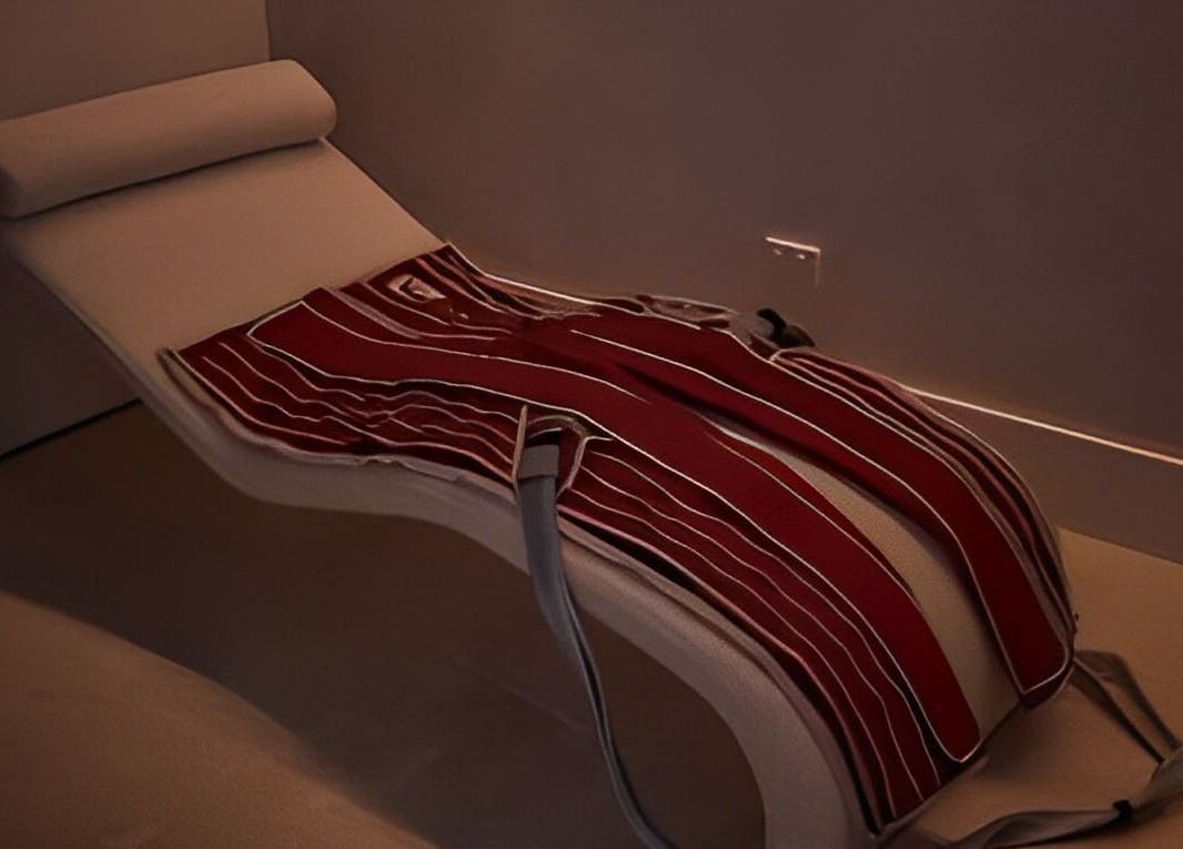 Comfortable relaxation lounger with a red striped blanket at Safir House, Merimbula, New South Wales, AU.