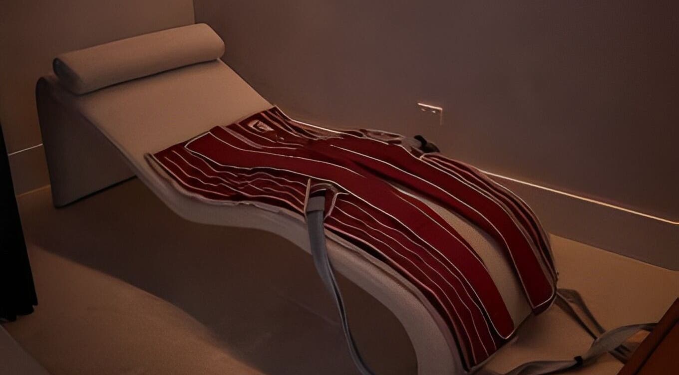 Comfortable relaxation lounger with a red striped blanket at Safir House, Merimbula, New South Wales, AU.