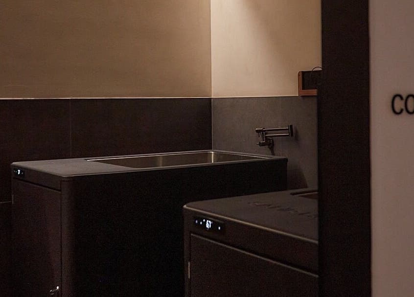 Modern cold plunge area at Safir House in Merimbula, New South Wales, AU with sleek dark design.