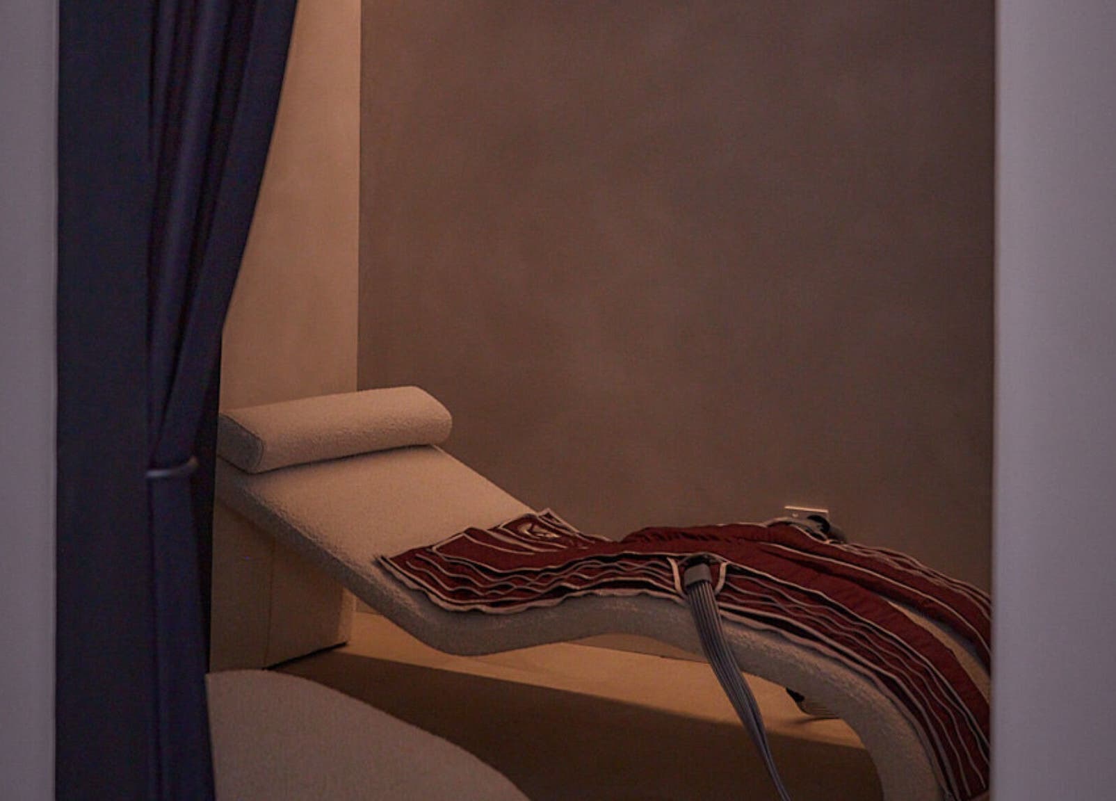 Tranquil lounge chair at Safir House, Merimbula, New South Wales, AU, perfect for serene relaxation.