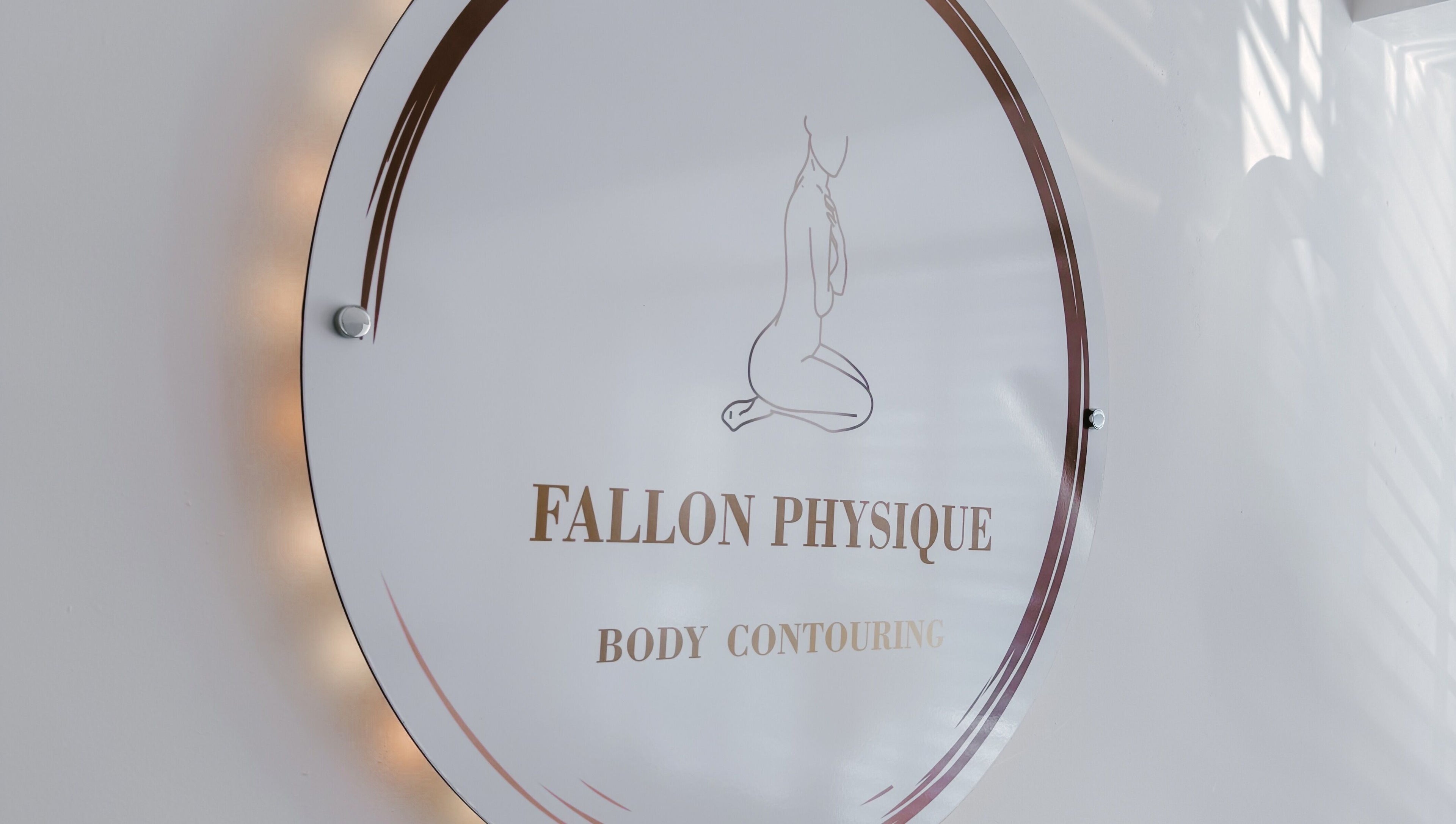 Fallon Physique sign displaying body contouring services in Bordon, England, GB with stylish design.