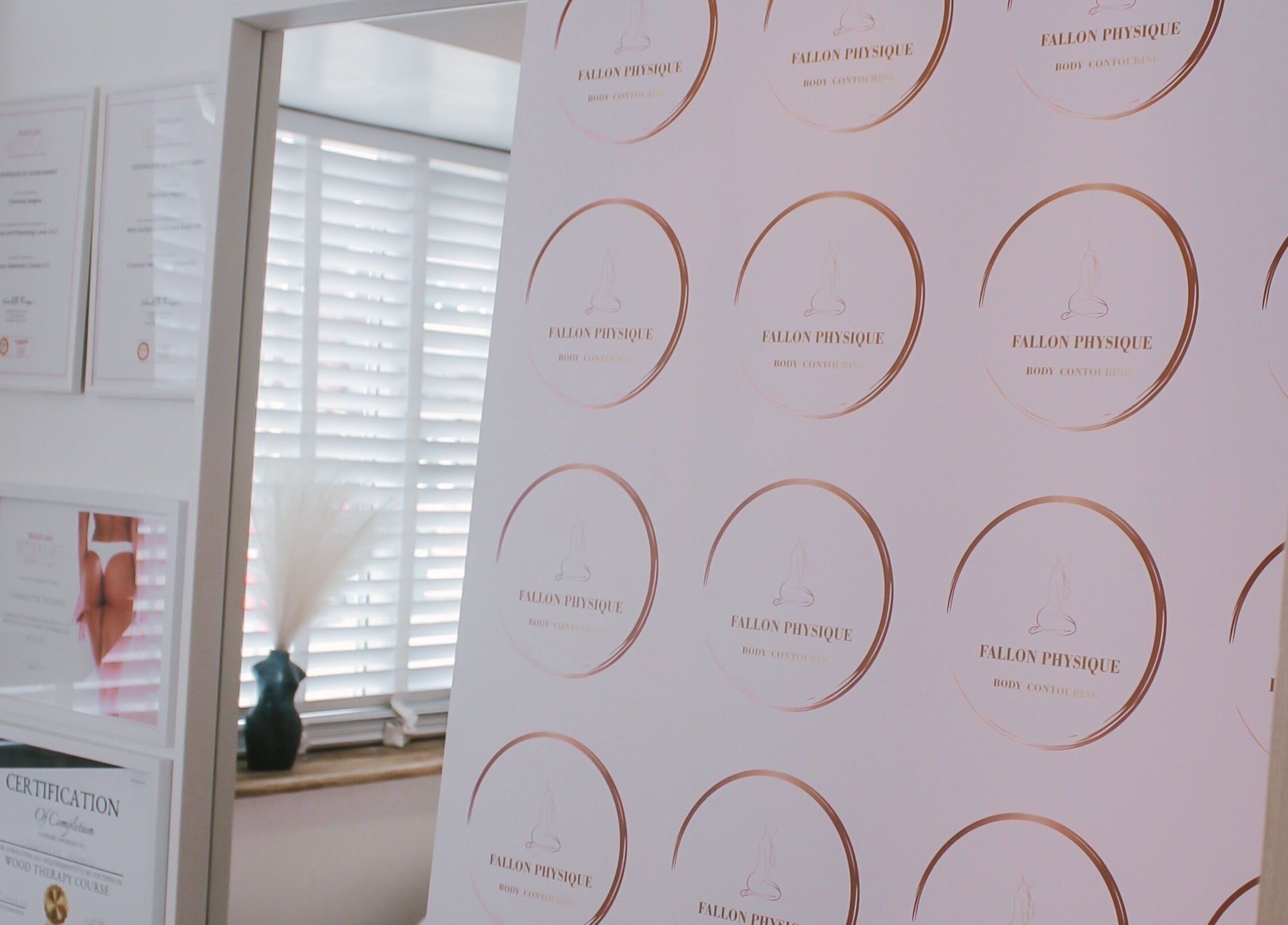 Fallon Physique certificates displayed elegantly in Bordon, England, GB wellness center.