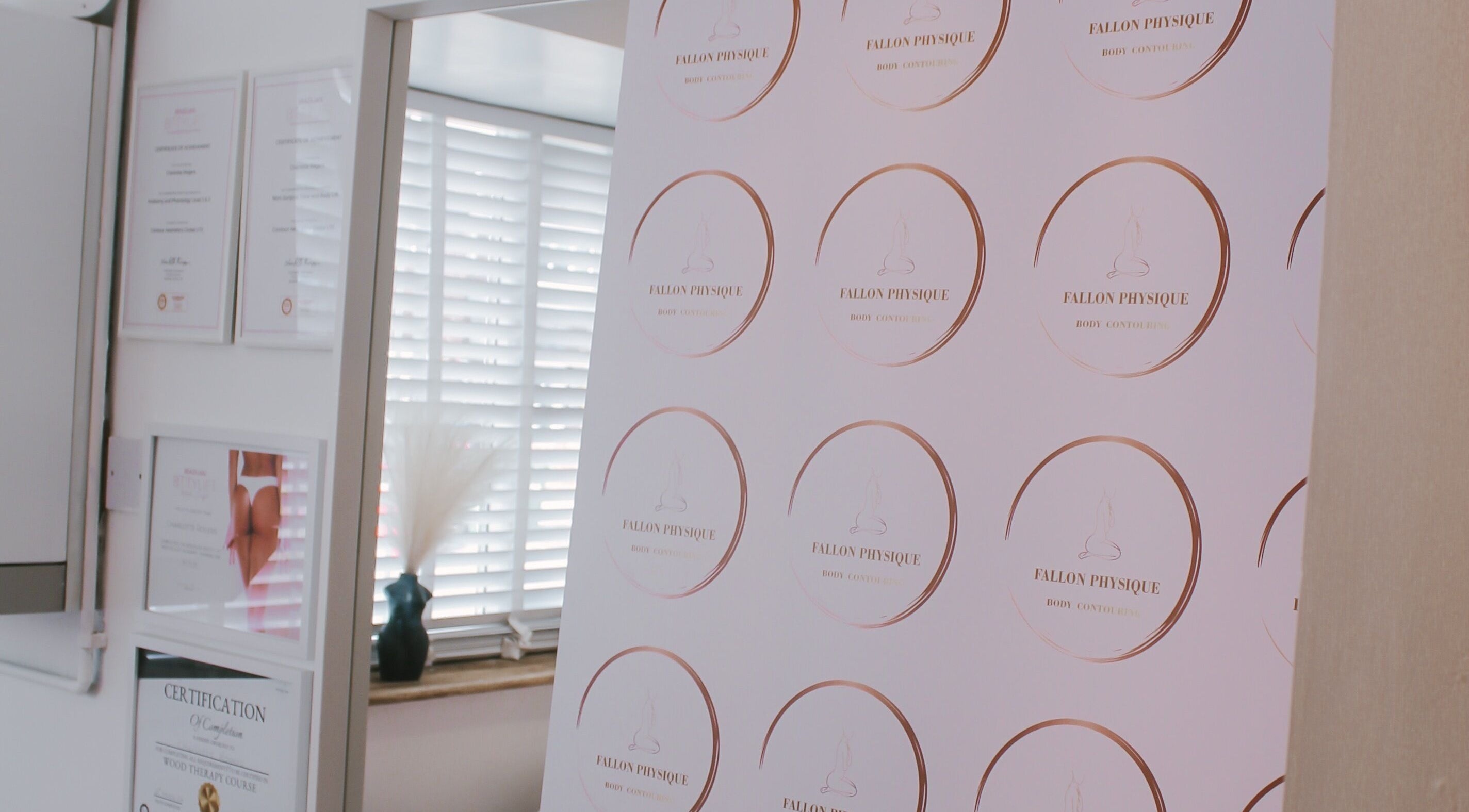 Fallon Physique certificates displayed elegantly in Bordon, England, GB wellness center.