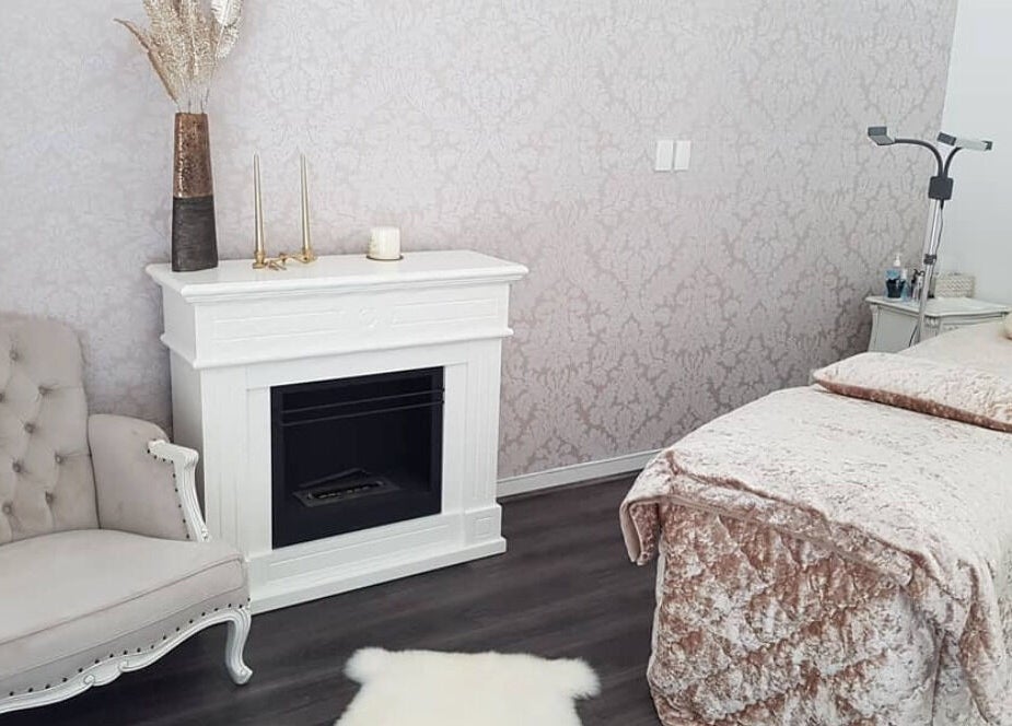 Elegantly designed spa room at Crystal Spa, Perth, Western Australia, AU with plush seating and cozy massage table.