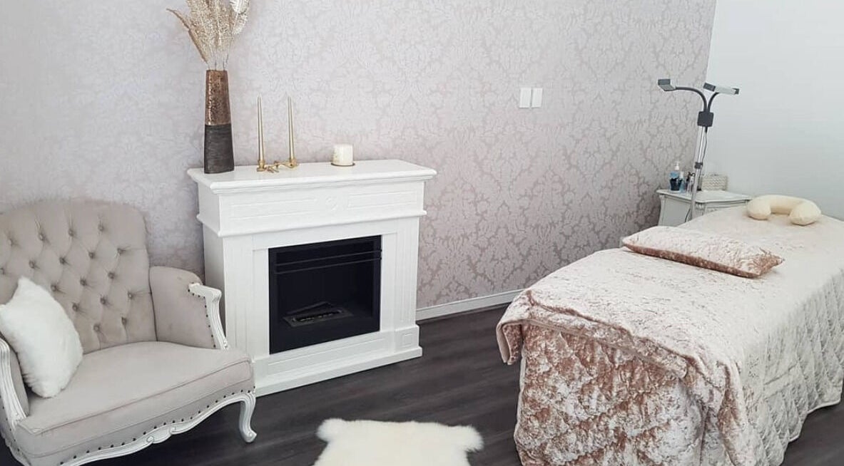 Elegantly designed spa room at Crystal Spa, Perth, Western Australia, AU with plush seating and cozy massage table.