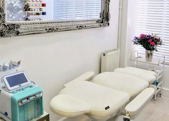 Modern treatment room at Amber Beauties, Goffs Oak, England, GB, with advanced equipment and elegant decor.