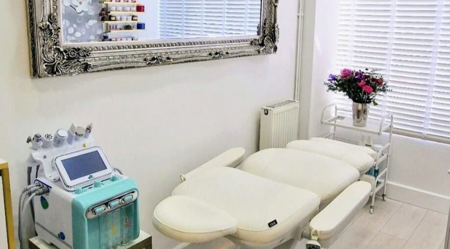 Modern treatment room at Amber Beauties, Goffs Oak, England, GB, with advanced equipment and elegant decor.