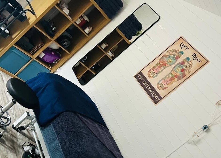 Relaxing therapy room at Blissful Touch, Bugle, England, GB, showcasing a cozy massage bed and calming decor.