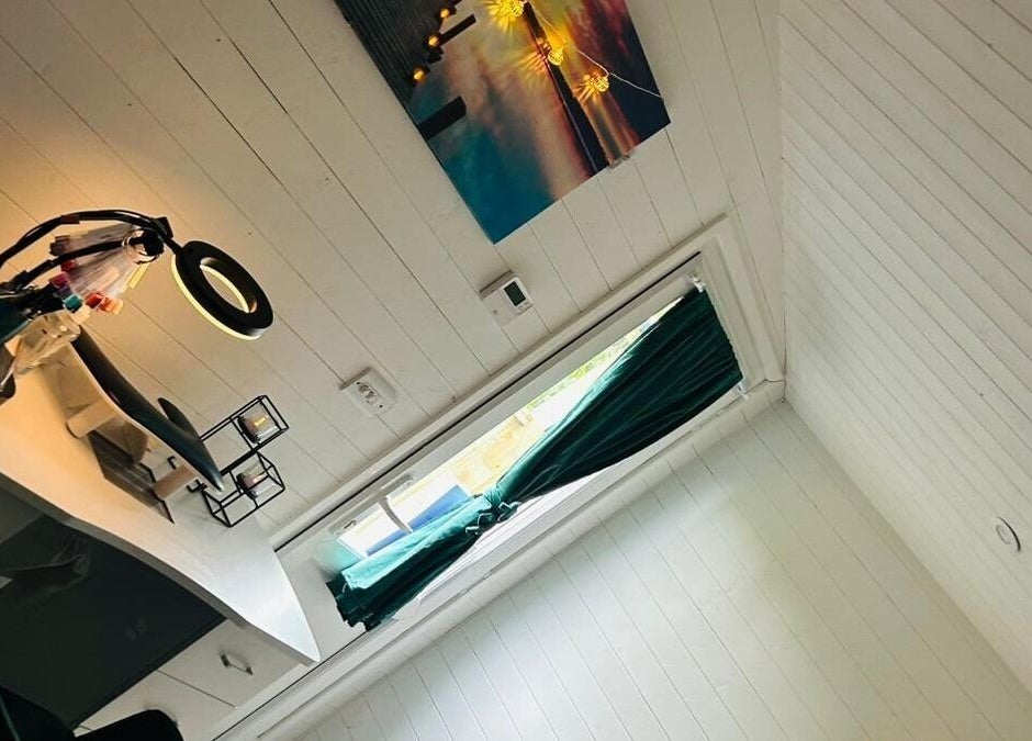 Cozy work area at Blissful Touch, Bugle, England, GB with warm lighting and elegant decor.