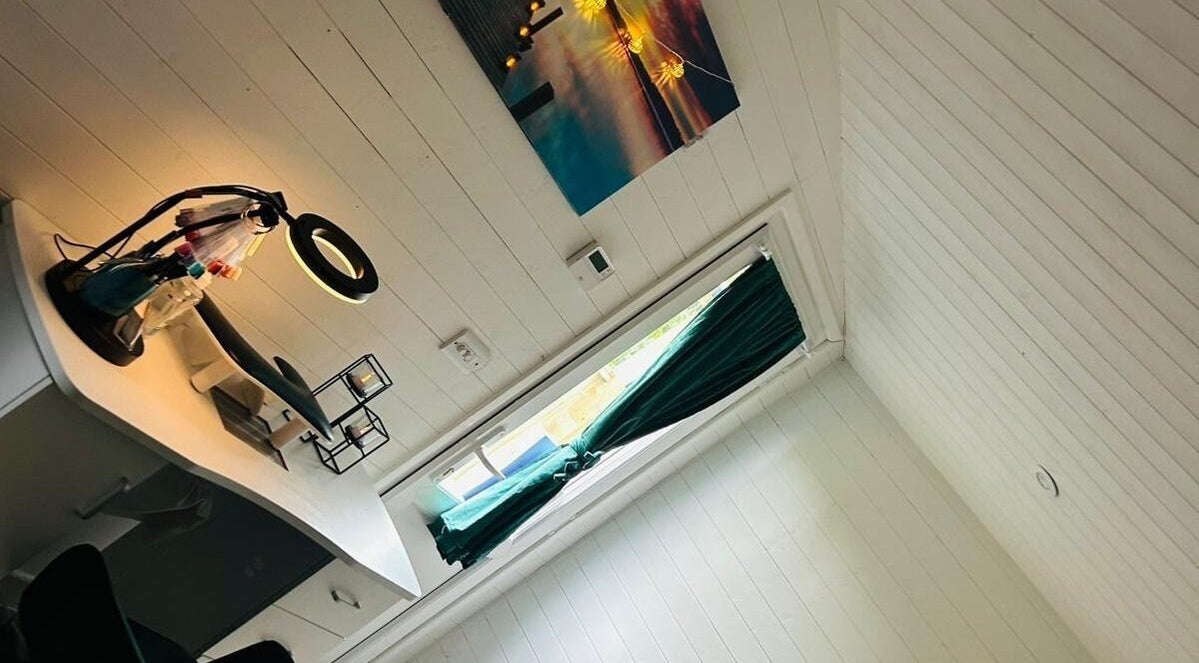 Cozy work area at Blissful Touch, Bugle, England, GB with warm lighting and elegant decor.