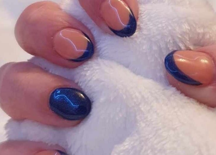 Close-up of blue and nude nails from Blissful Touch in Bugle, England, GB, showcasing elegant nail art.