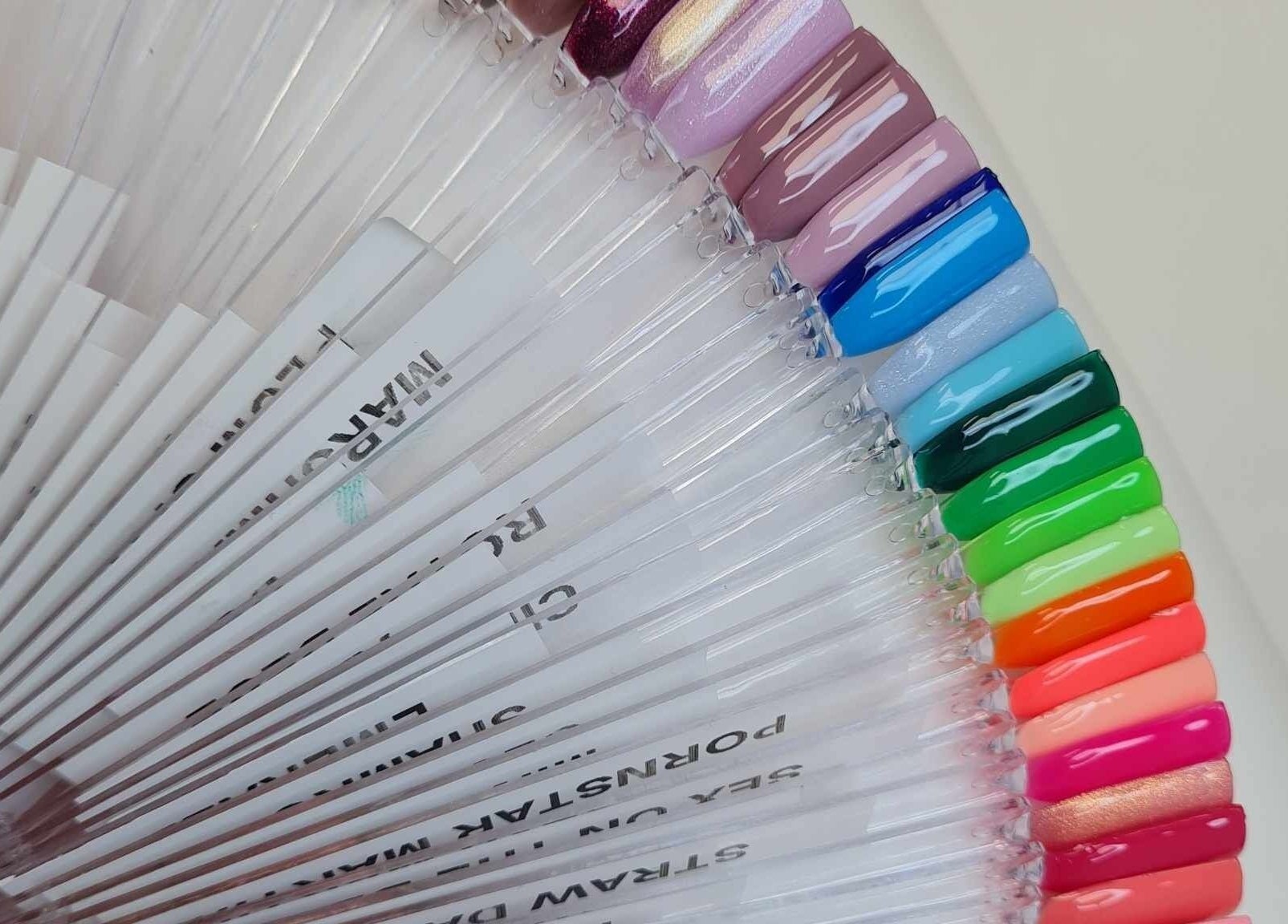 Colorful nail polish display at Blissful Touch in Bugle, England, GB showcasing vibrant options.