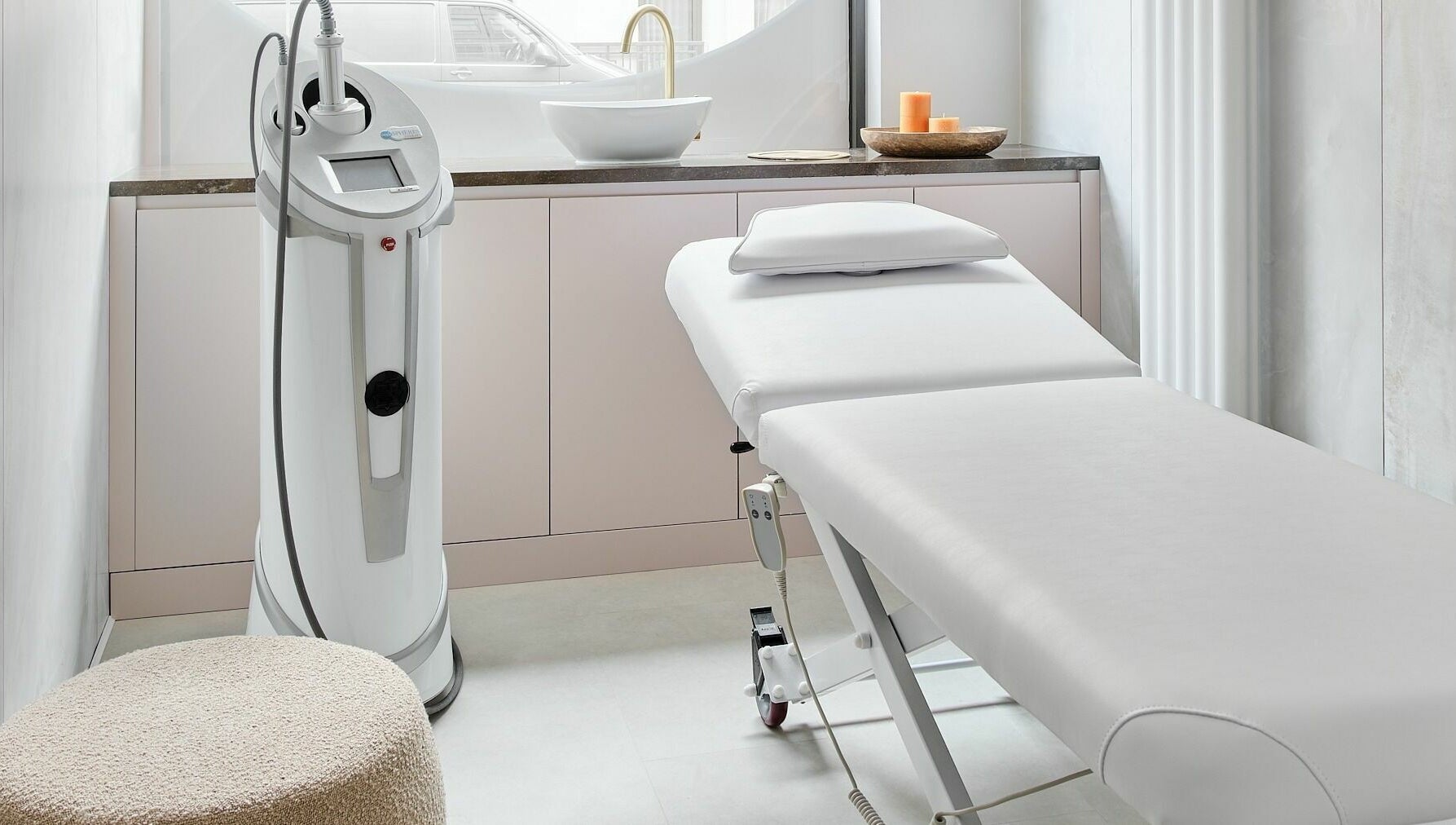Treatment room at Victoria Aesthetics in London, England, GB with modern equipment and a spa bed.