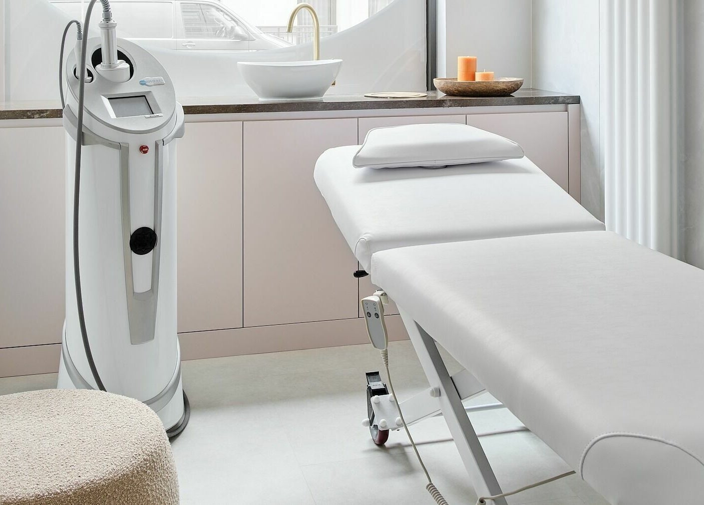 Treatment room at Victoria Aesthetics in London, England, GB with modern equipment and a spa bed.
