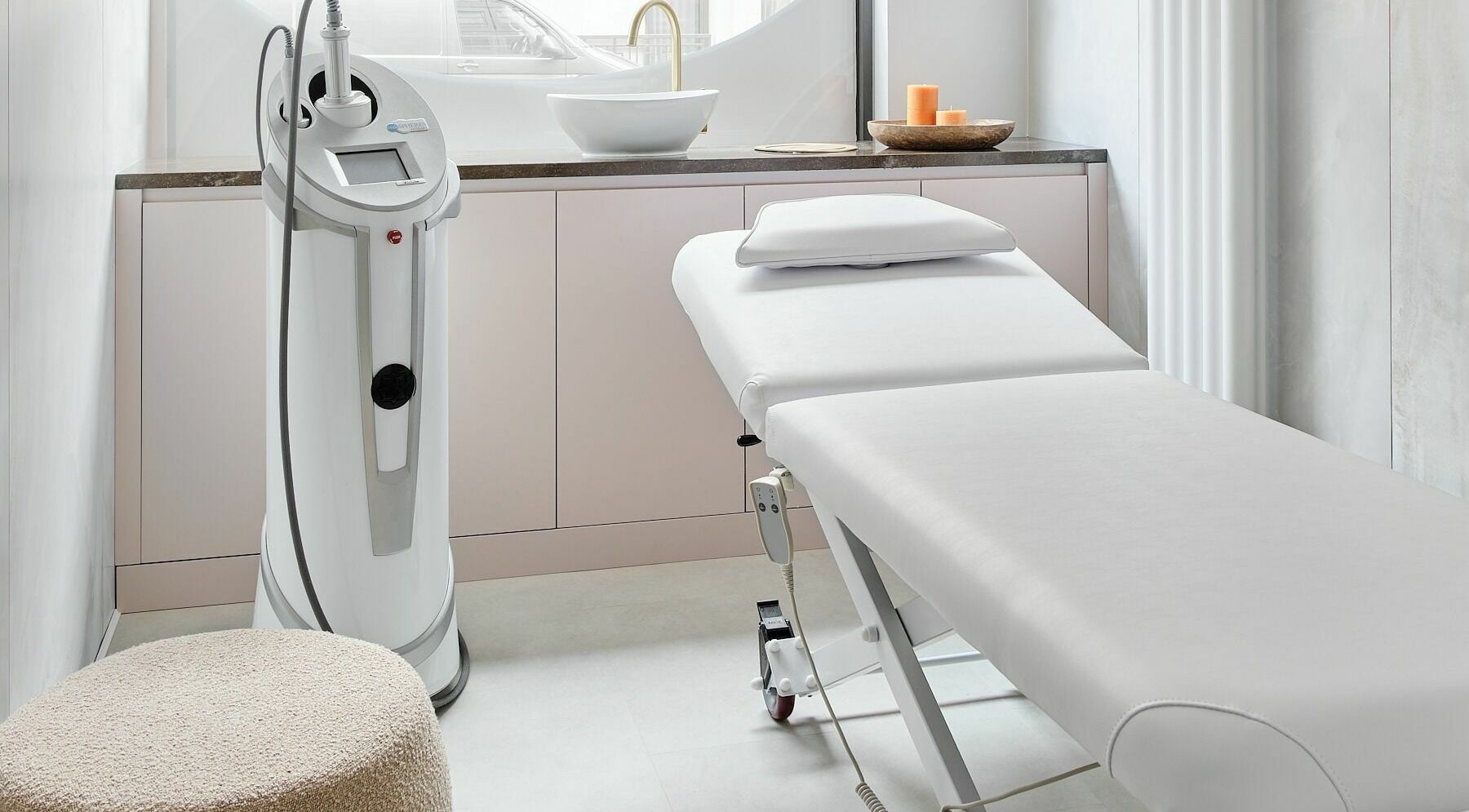 Treatment room at Victoria Aesthetics in London, England, GB with modern equipment and a spa bed.