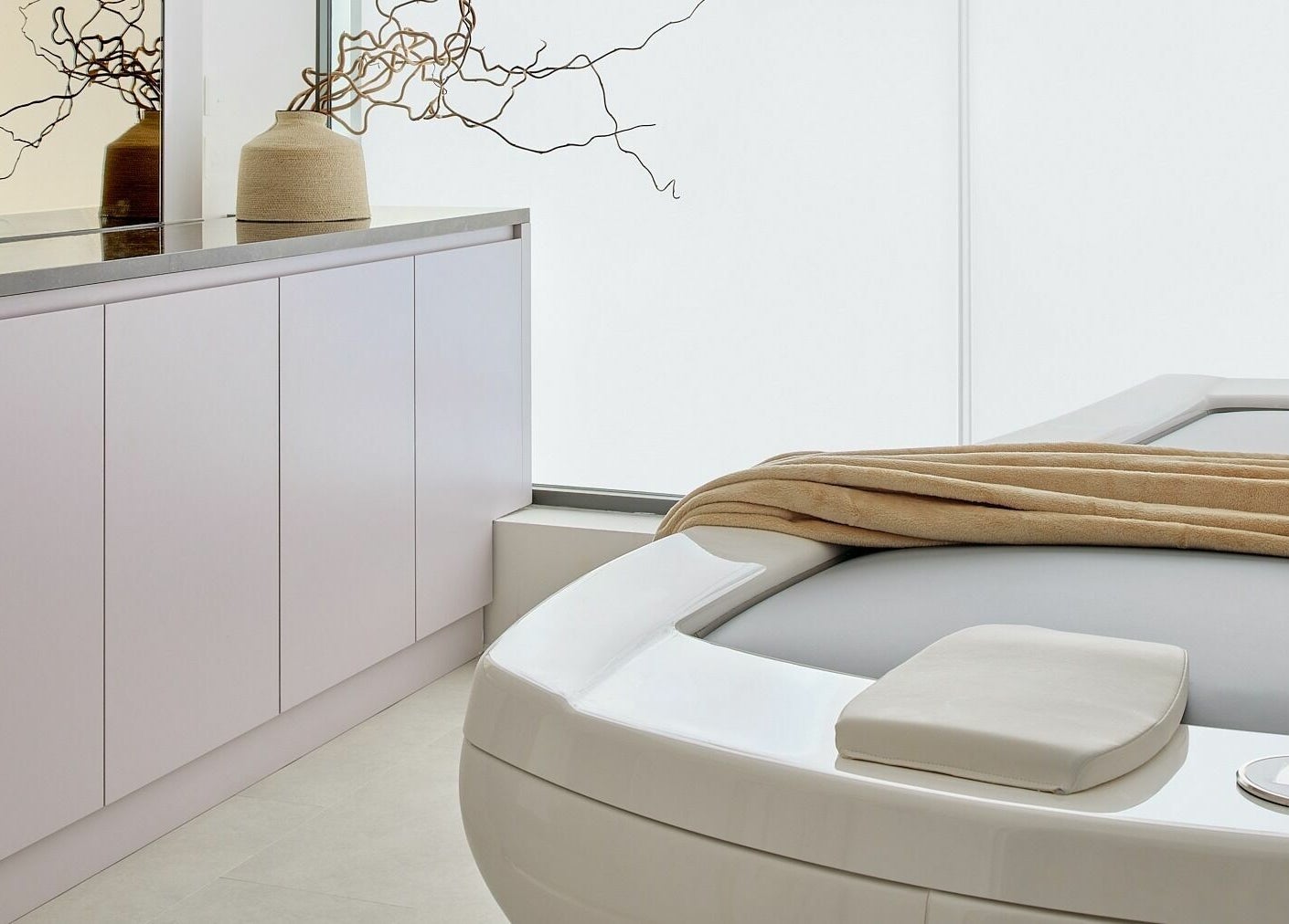 Spa room at Victoria Aesthetics in London, England, GB with modern decor and a tranquil massage bed.