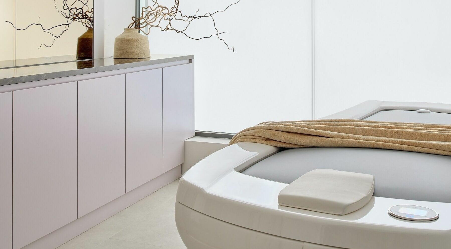 Spa room at Victoria Aesthetics in London, England, GB with modern decor and a tranquil massage bed.
