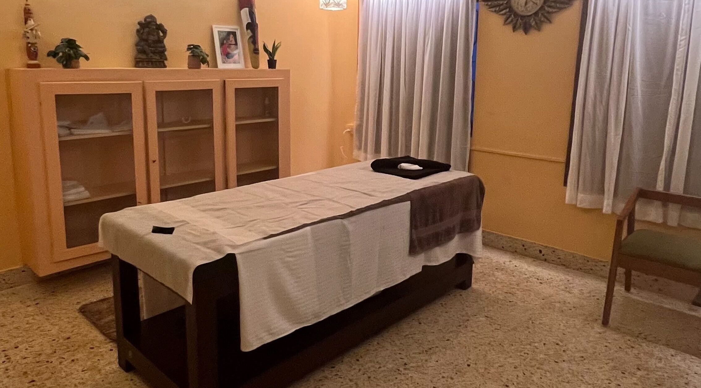 Cozy massage room at Praana Ayur Spa by Sarwaa in Varkala, Kerala, IN with a prepared treatment bed.