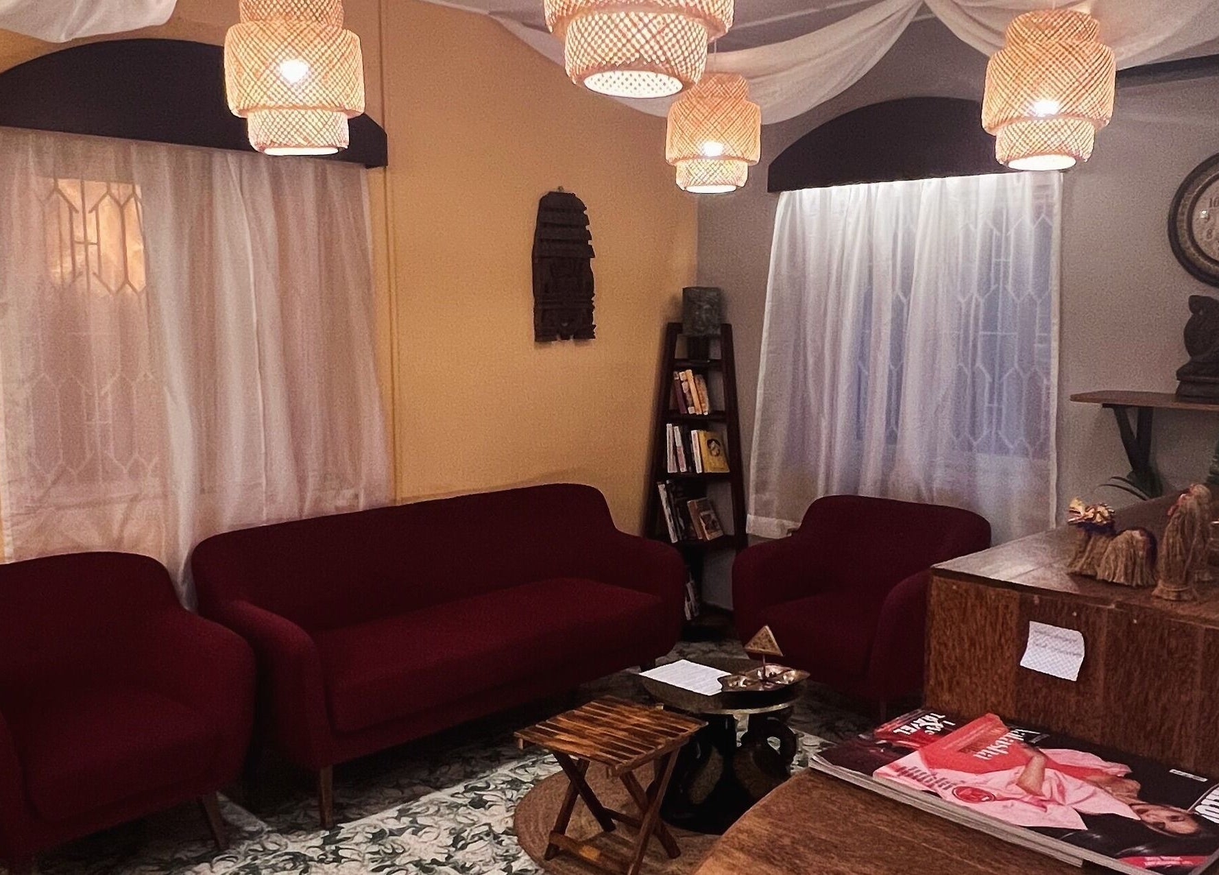 Elegant lounge area at Praana Ayur Spa by Sarwaa, Varkala, Kerala, IN with plush seating and cultural decor.