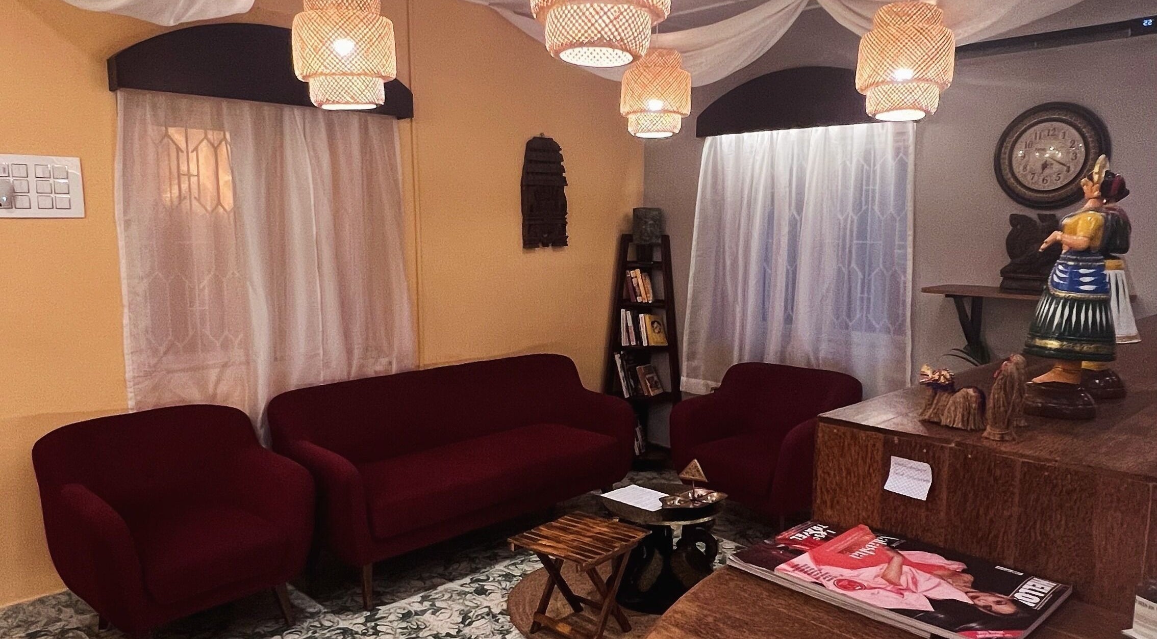 Elegant lounge area at Praana Ayur Spa by Sarwaa, Varkala, Kerala, IN with plush seating and cultural decor.