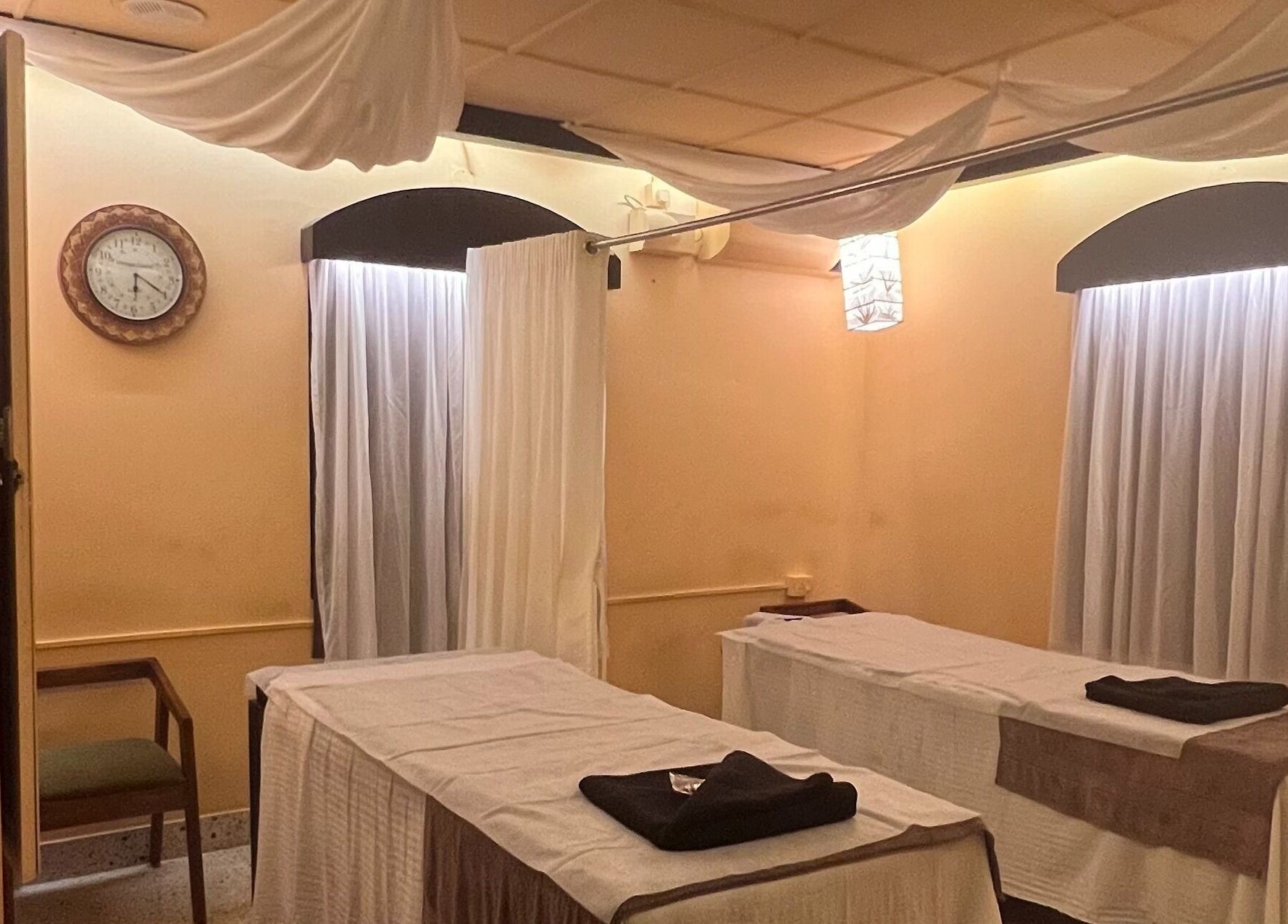 Elegant treatment room at Praana Ayur Spa by Sarwaa, Varkala, Kerala, IN, featuring calming décor and treatment tables.