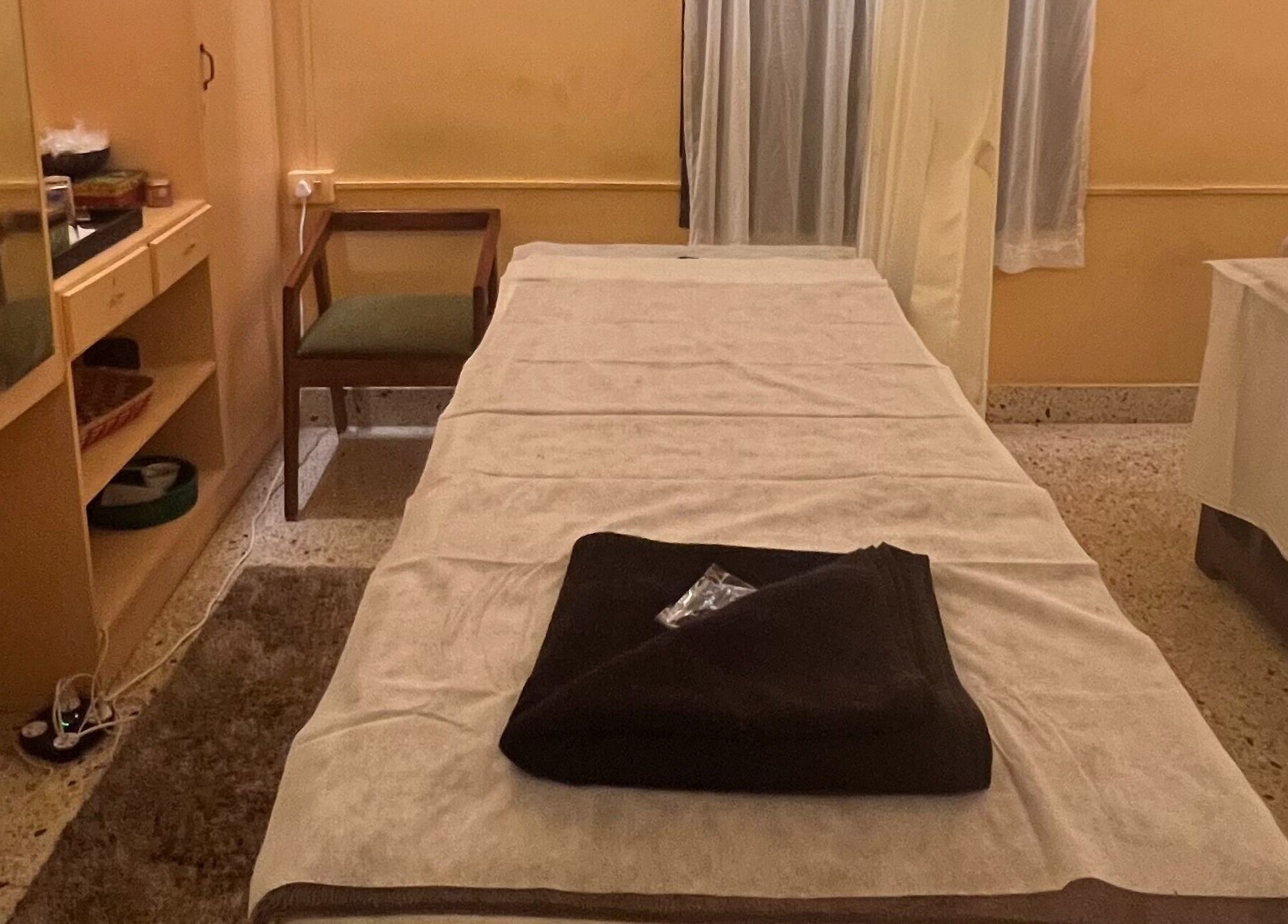 Massage table in serene room at Praana Ayur Spa by Sarwaa, Varkala, Kerala, IN.